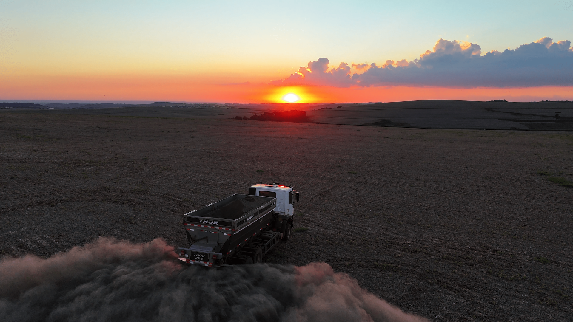 Photo of crushed minerals being spread on farmland in Brazil
