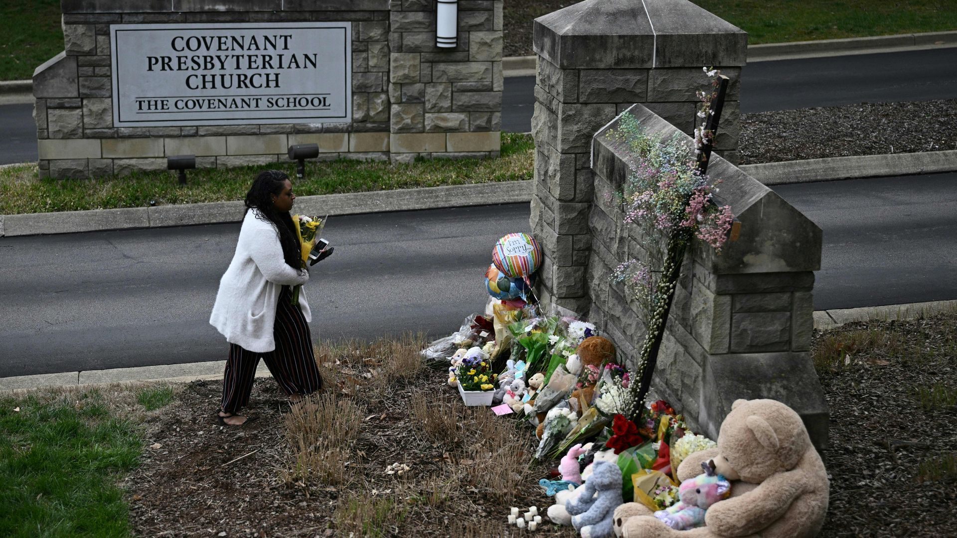 Mourner at a memorial for the Covenant School 
