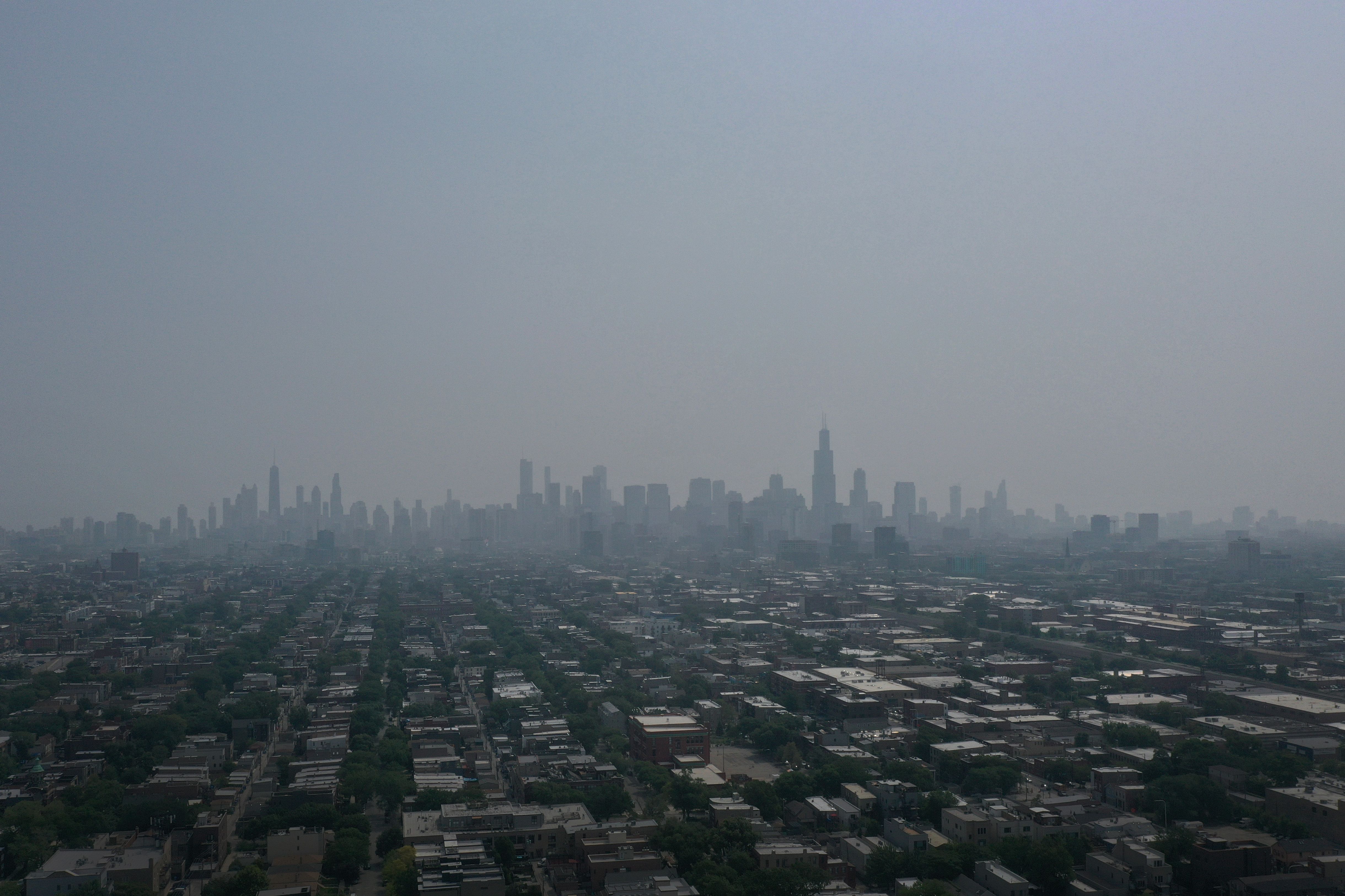 Smoke from Canadian wildfires obscures the skyline on July 25, 2023 in Chicago, Illinois. 