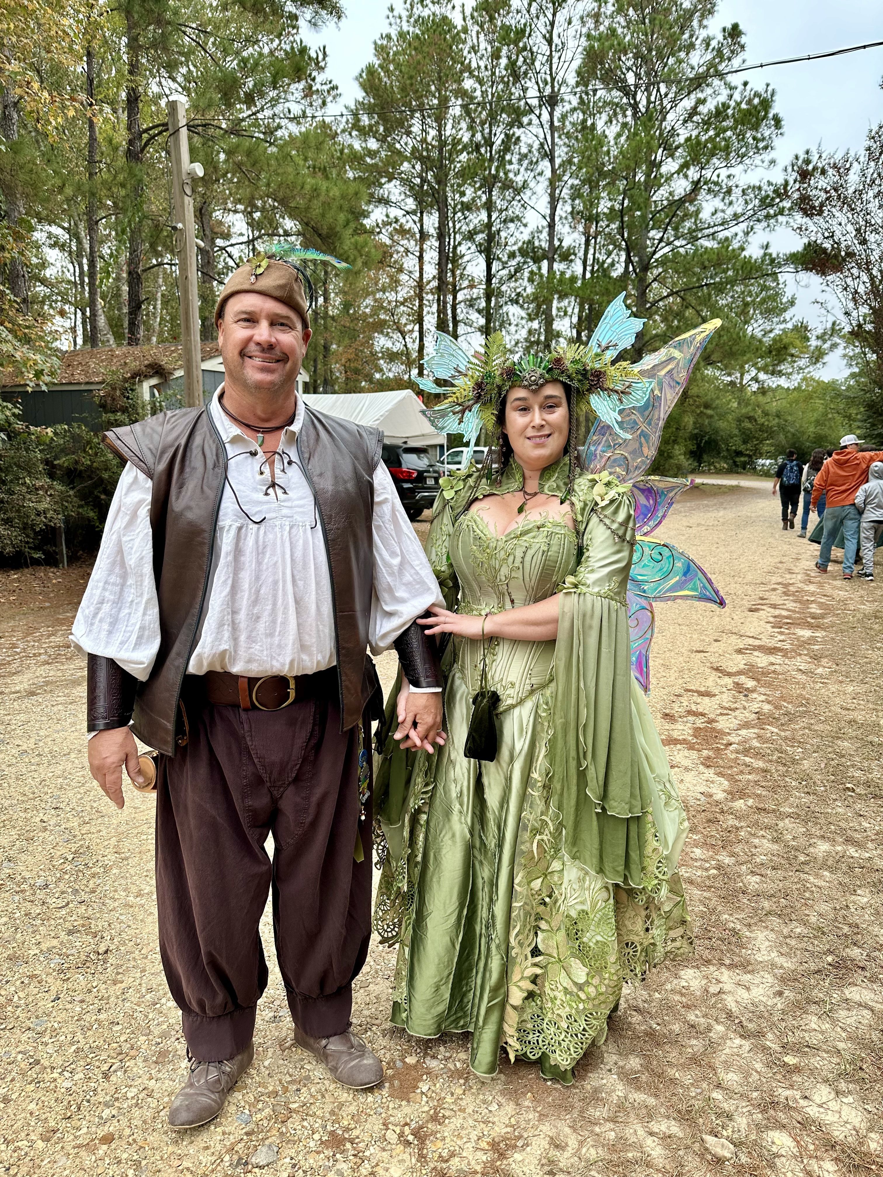 Photo shows people dressed as fairies.
