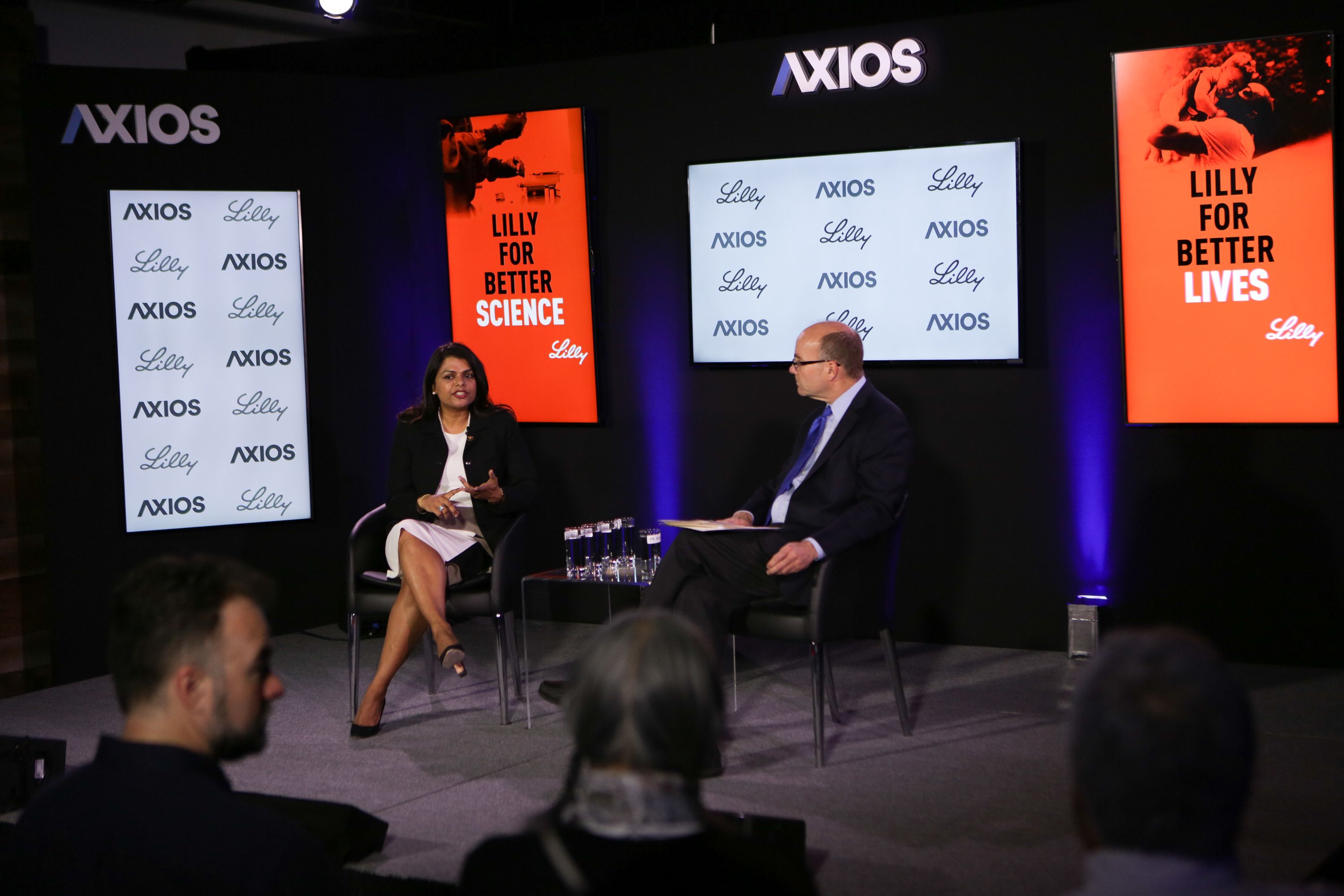 Dr. Vanila Singh and Mike Allen sit on the Axios stage.