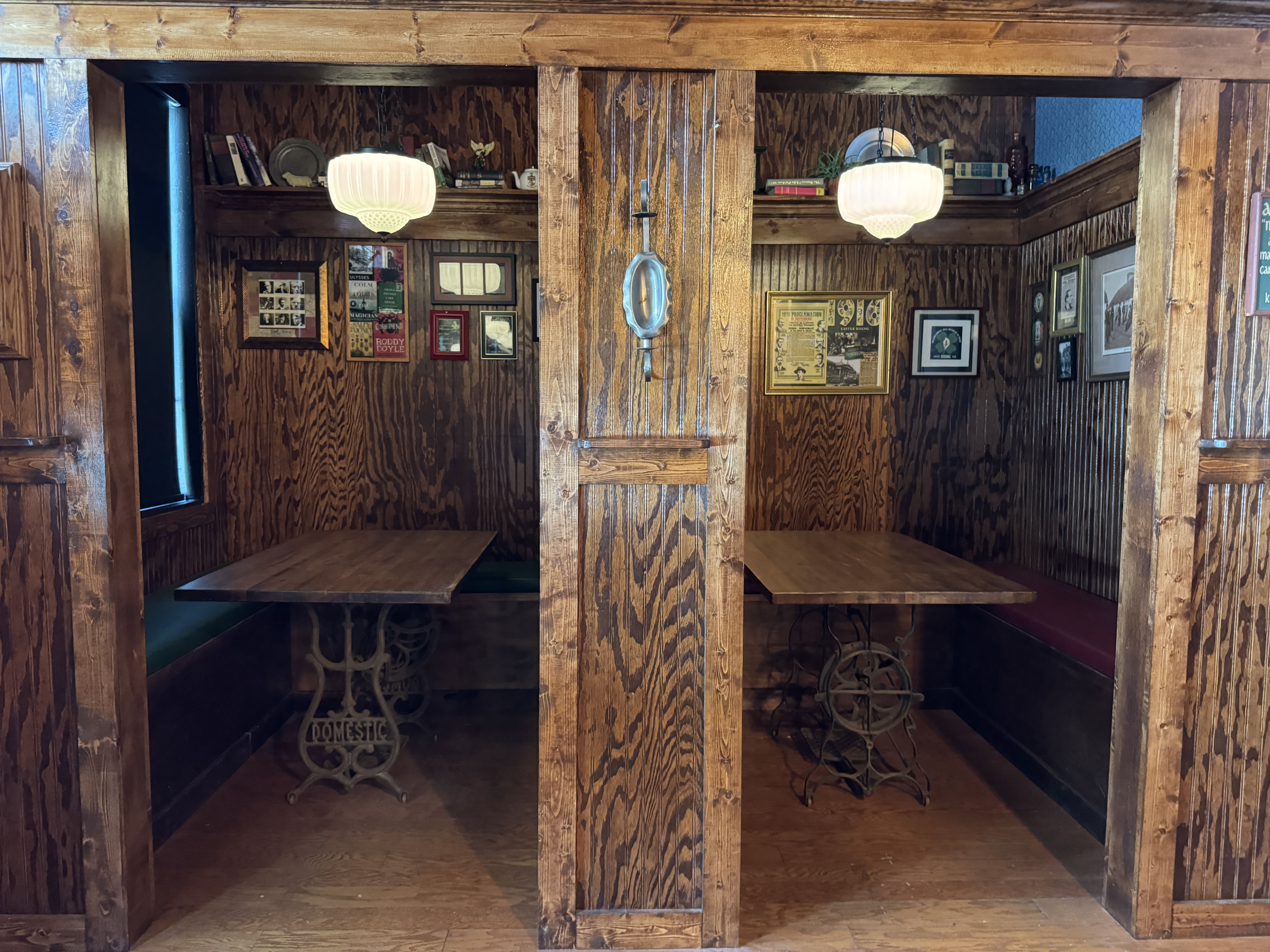 two booths wiht tables inside