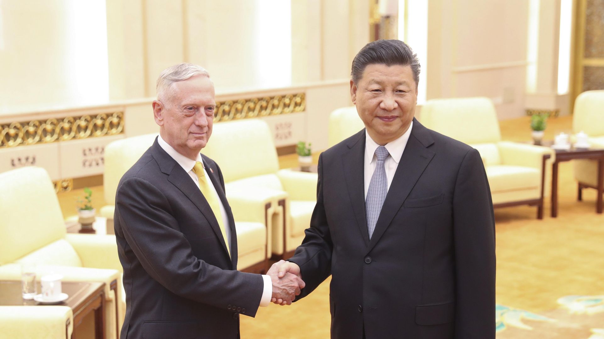 Mattis and Xi shake hands