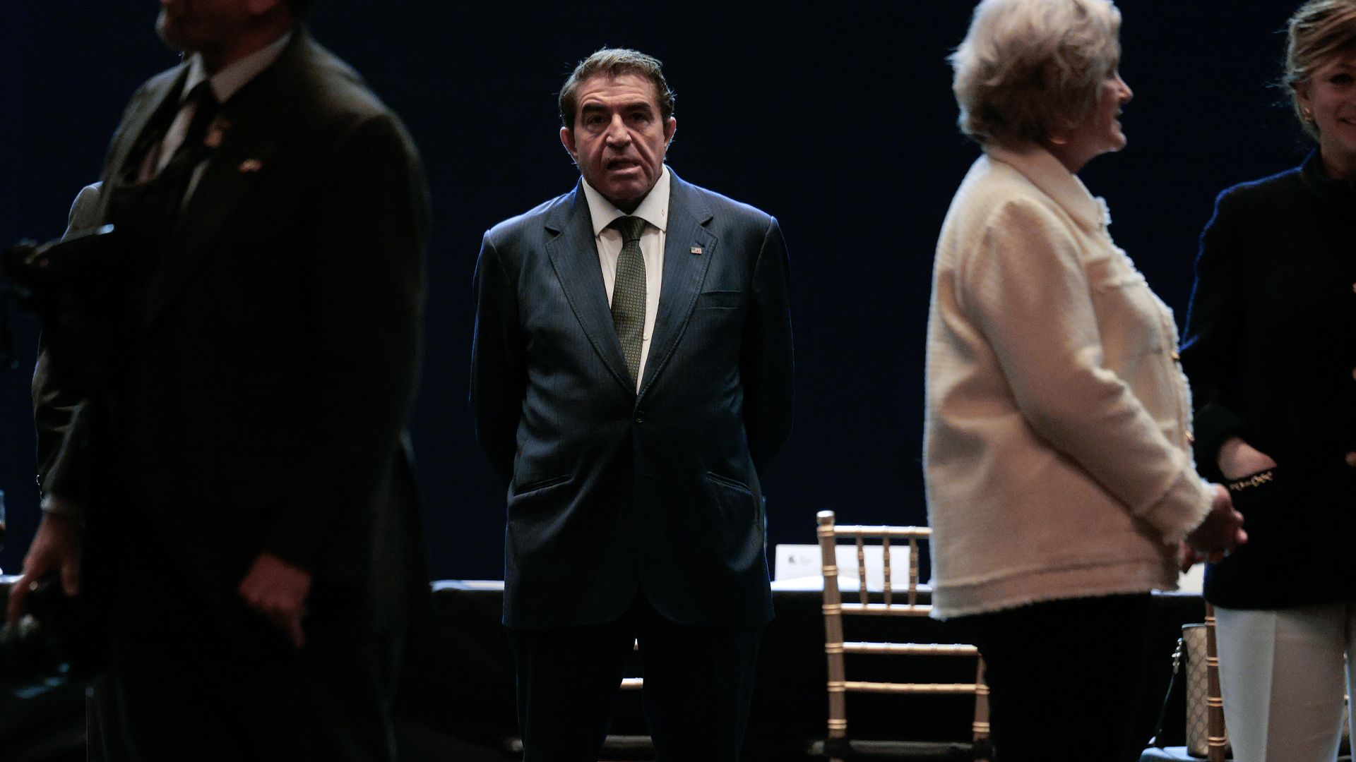 Paolo Zampolli stands inside a Kennedy Center stage surrounded by other board members following a meeting in 2025