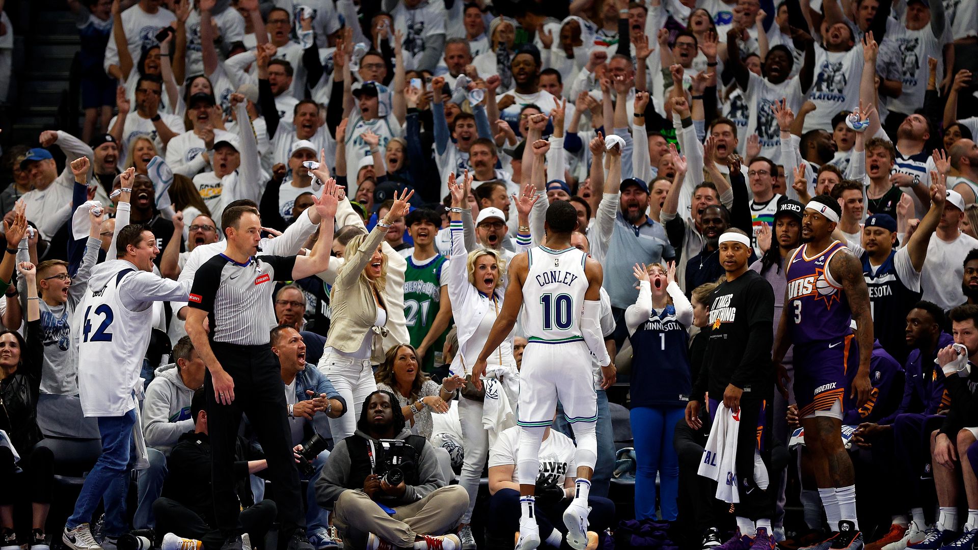 Mike Conley looks out at a sea of cheering Wolves fans 