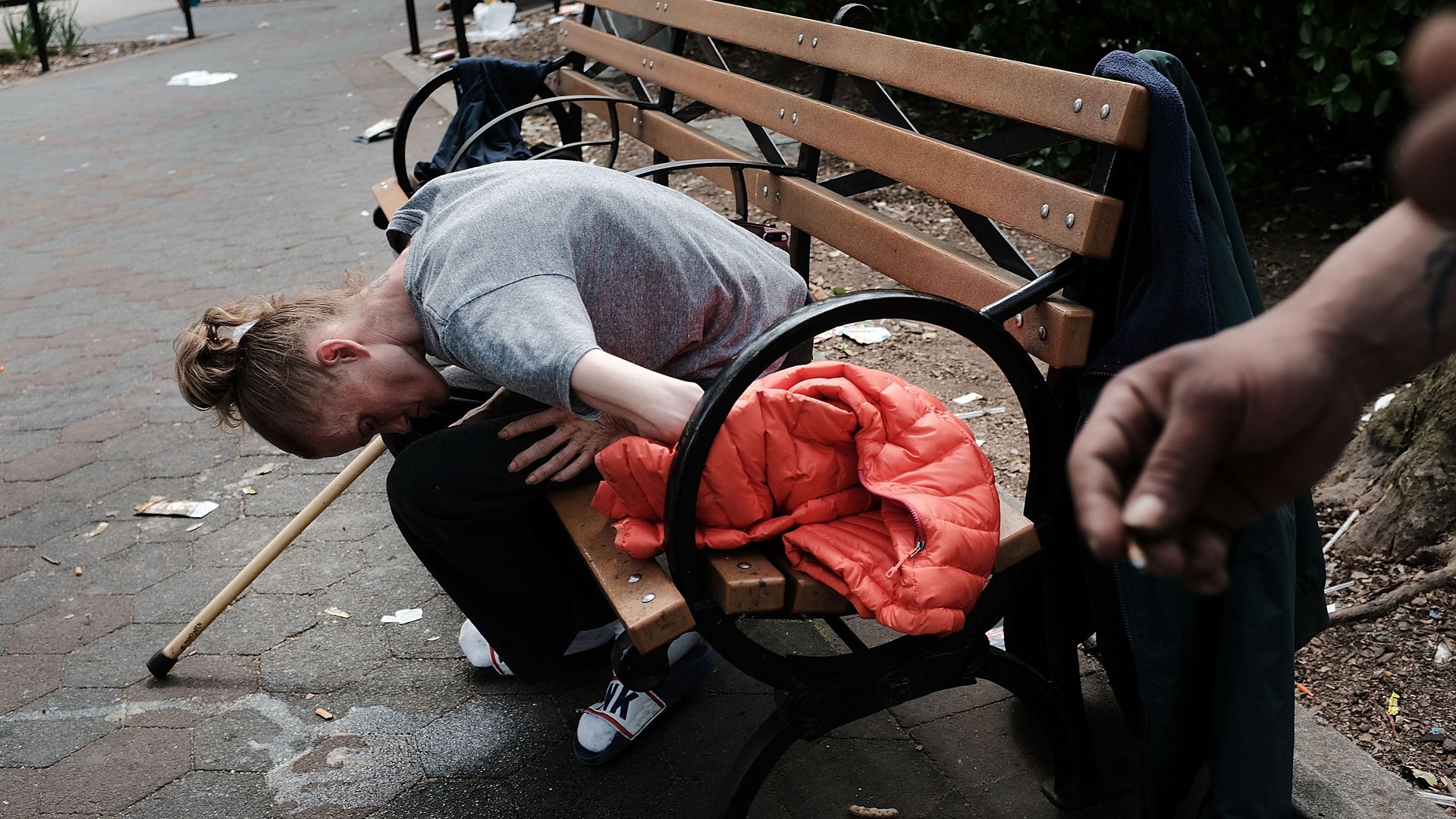 A heroin addict passed out in a park in New York City.