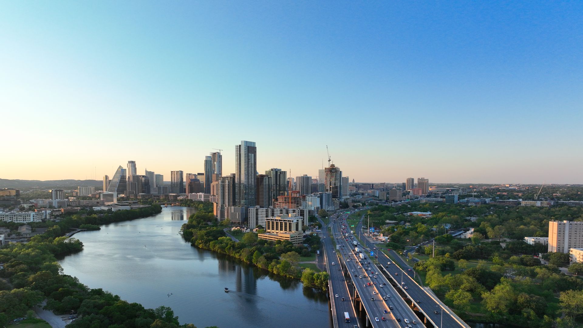 A photo of Austin's skyline, with a stretch of I-35 in the foreground.