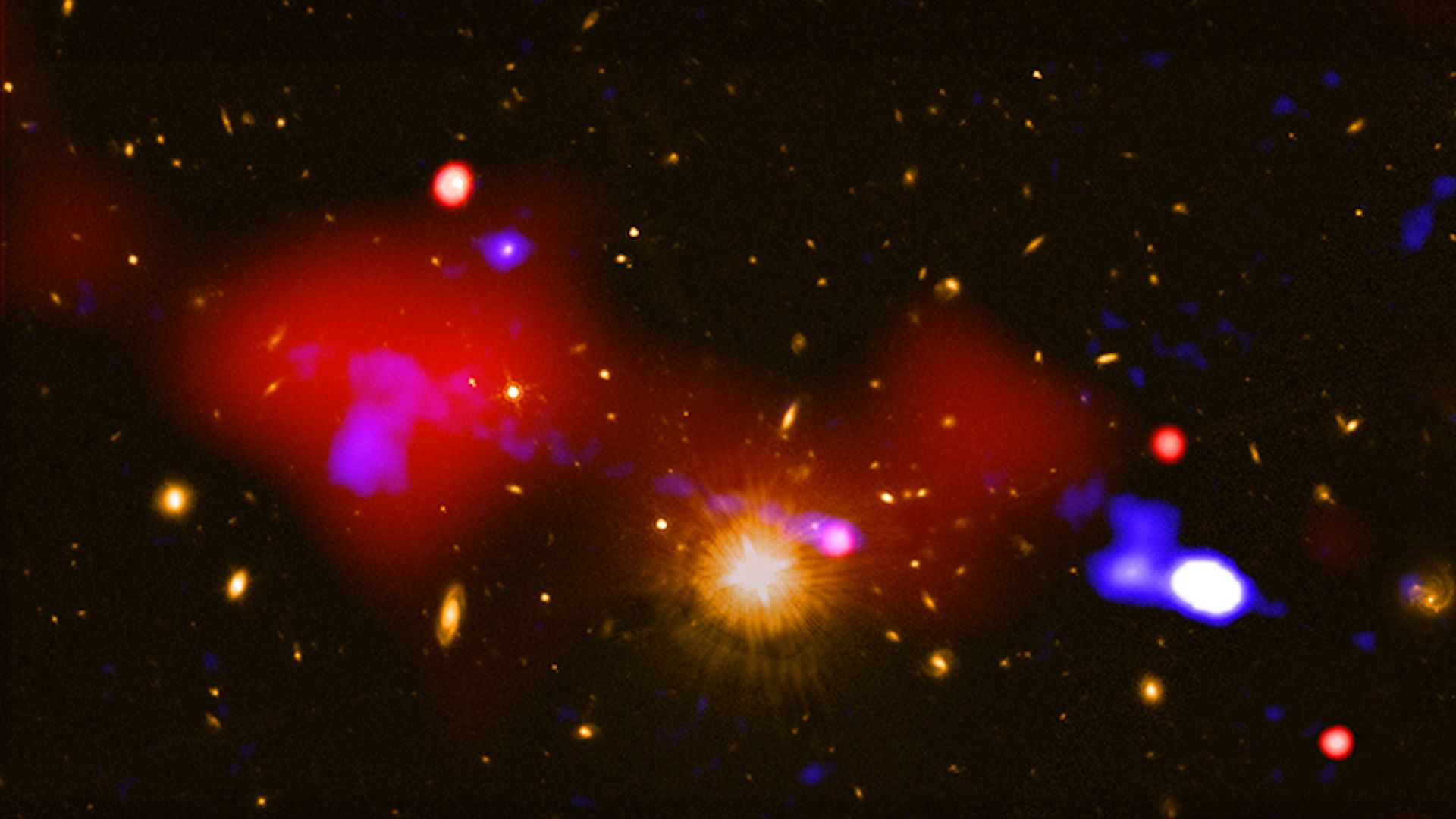 A colorful photo showing a black hole and its influence on other galaxies in deep space