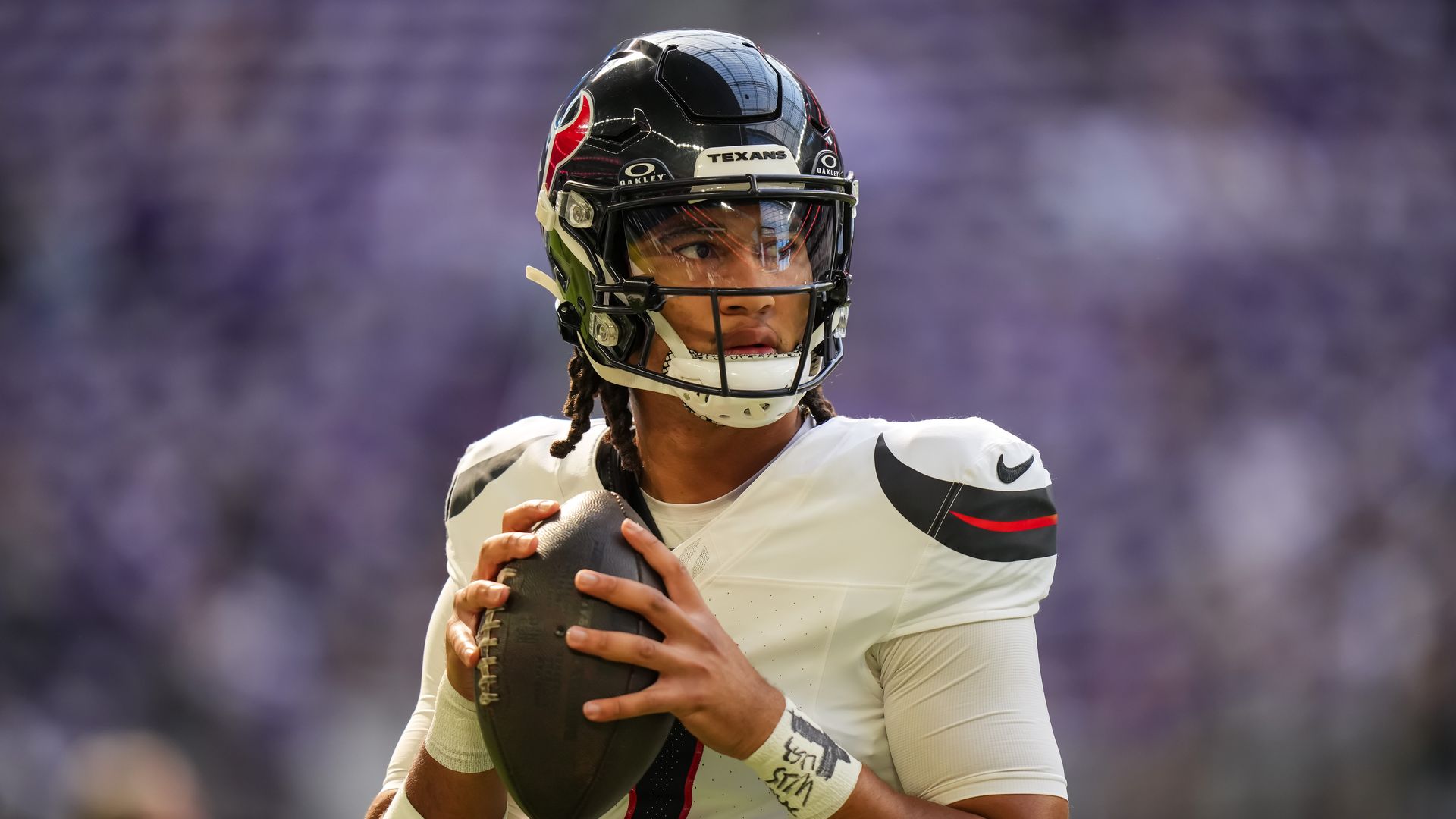 Texans quarterback C.J. Stroud holds a football