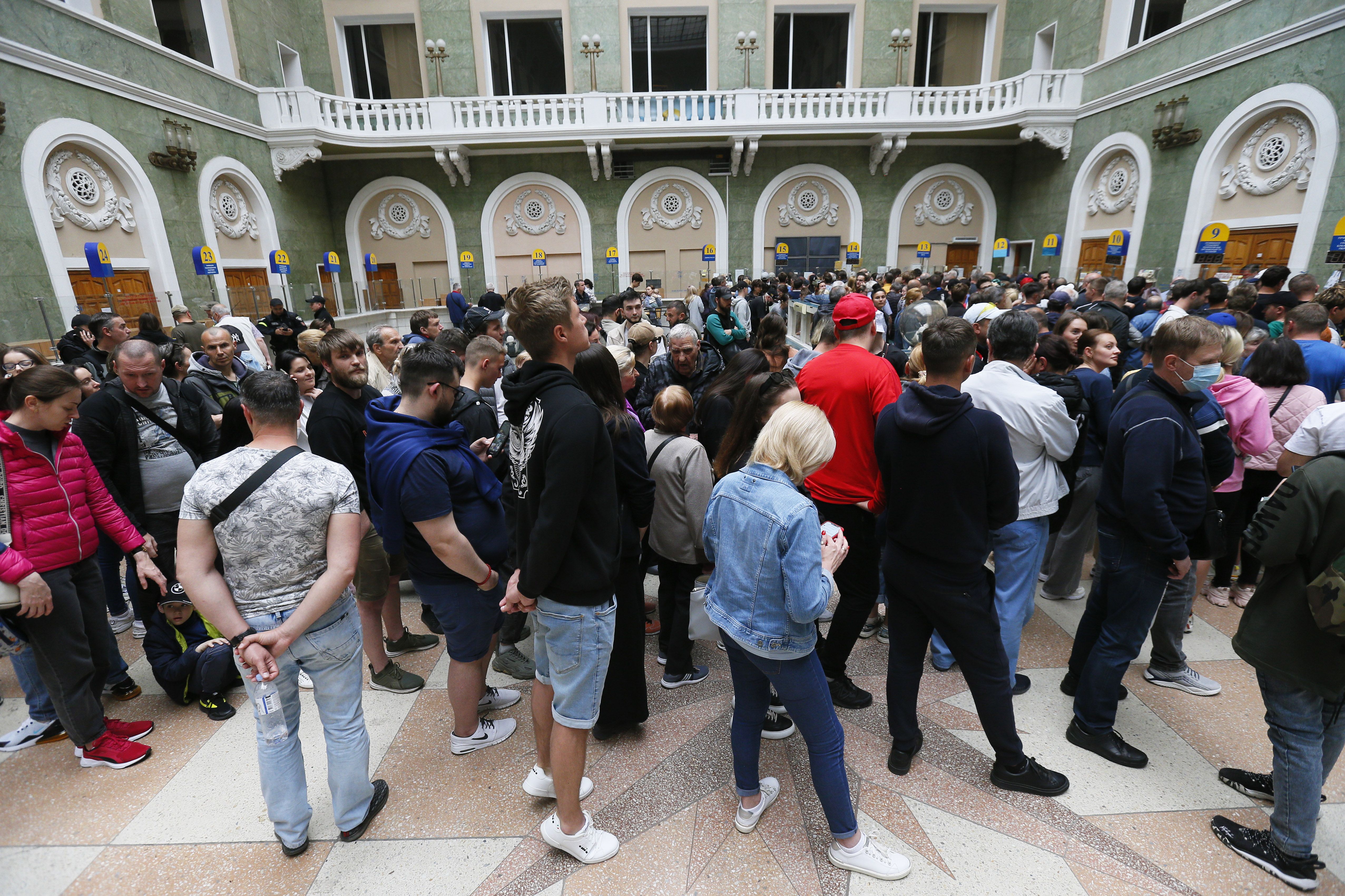  People queue to buy ommemorative postal service stamps called ''Russian warship done!', dedicated to the sinking of Russian warship Moskva, at main post office in Odesa, Ukraine 23 May.