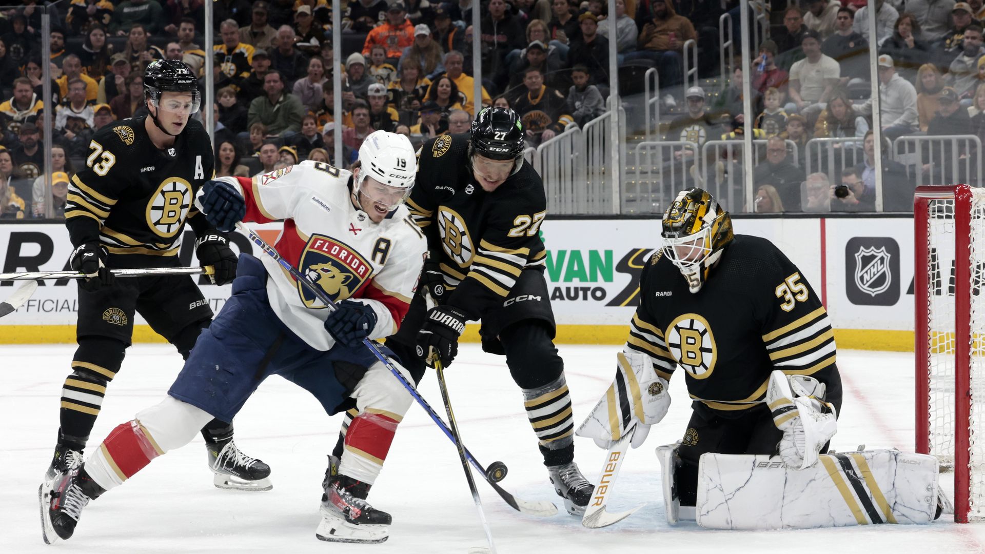 Florida Panthers right wing Matthew Tkachuk (19) tips the puck at Boston Bruins goalie Linus Ullmark (35) during a game between the Boston Bruins and the Florida Panthers on April 6, 2024, at TD Garden in Boston, Massachusetts. 