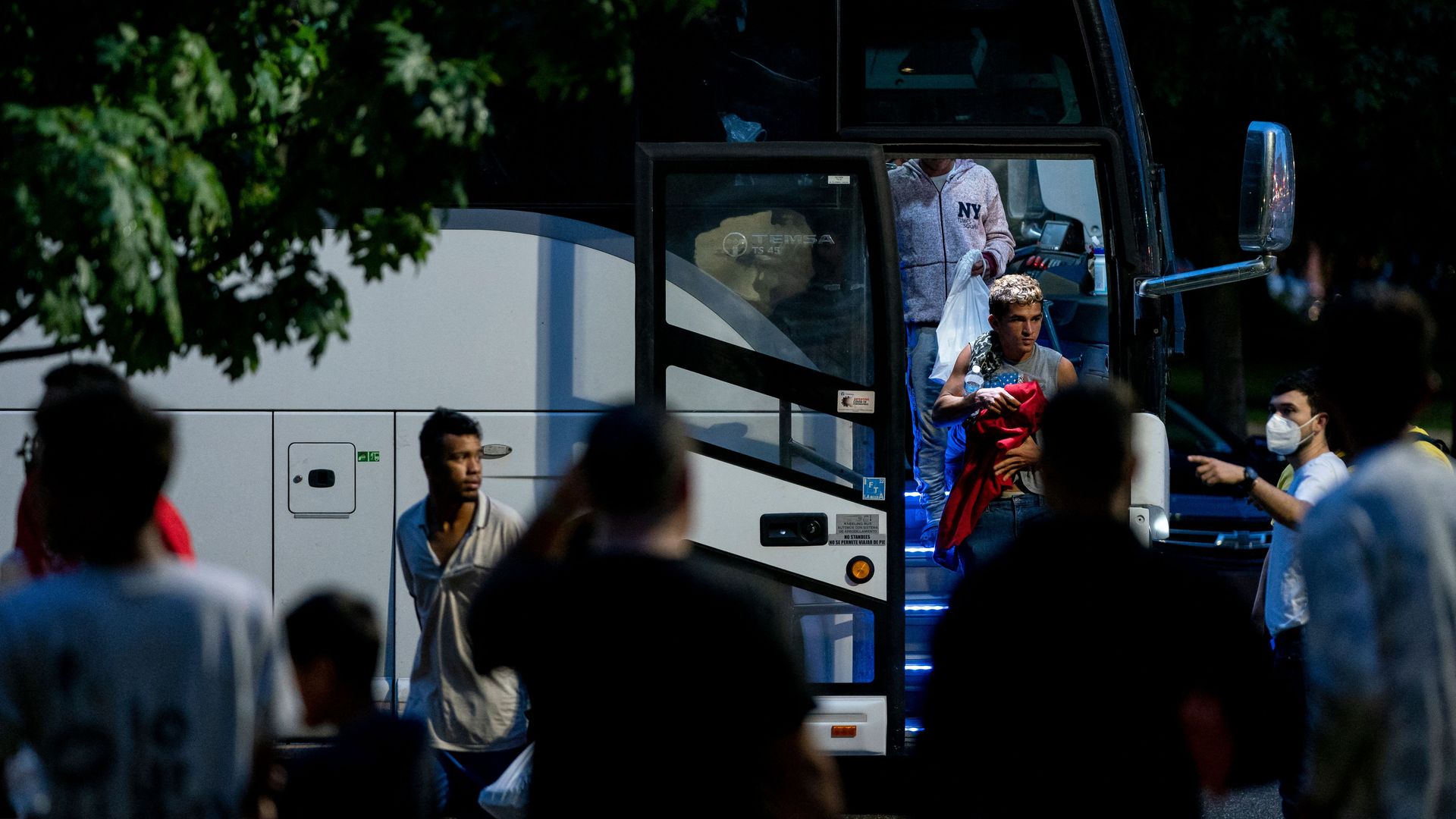 Migrants, who boarded a bus in Texas, are dropped off within view of the US Capitol building in Washington, DC.