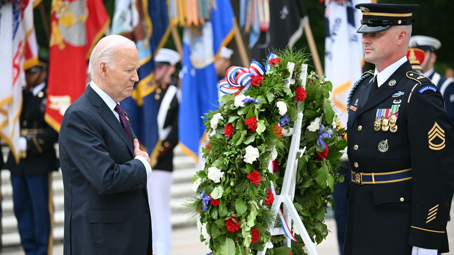 President Joe Biden participates in a wreath laying ceremony at the Tomb of the Unknown Soldier.