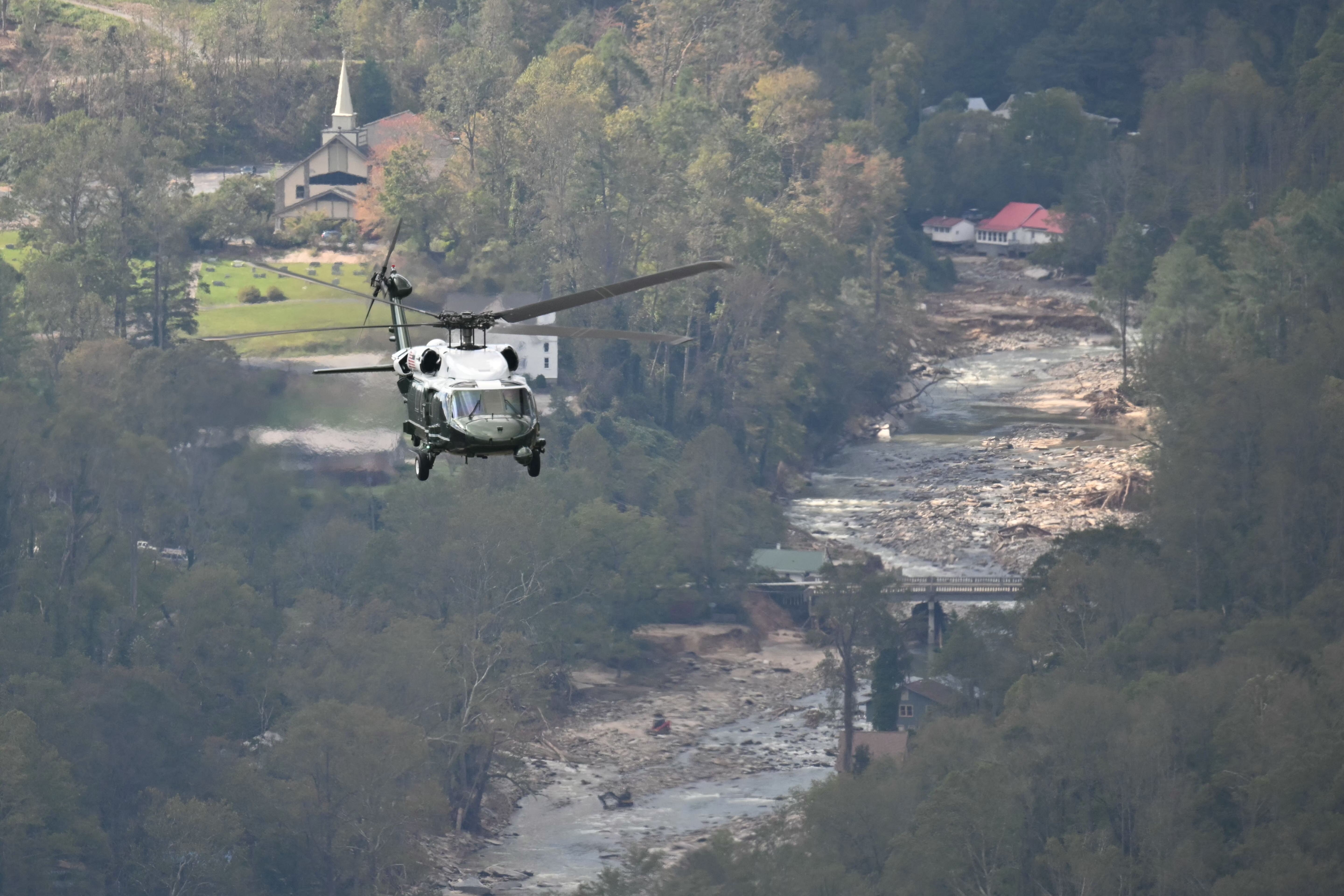* * Marine One, carrying US President Joe Biden, flies above a storm impacted area near Asheville, North Carolina on October 2, 2024.