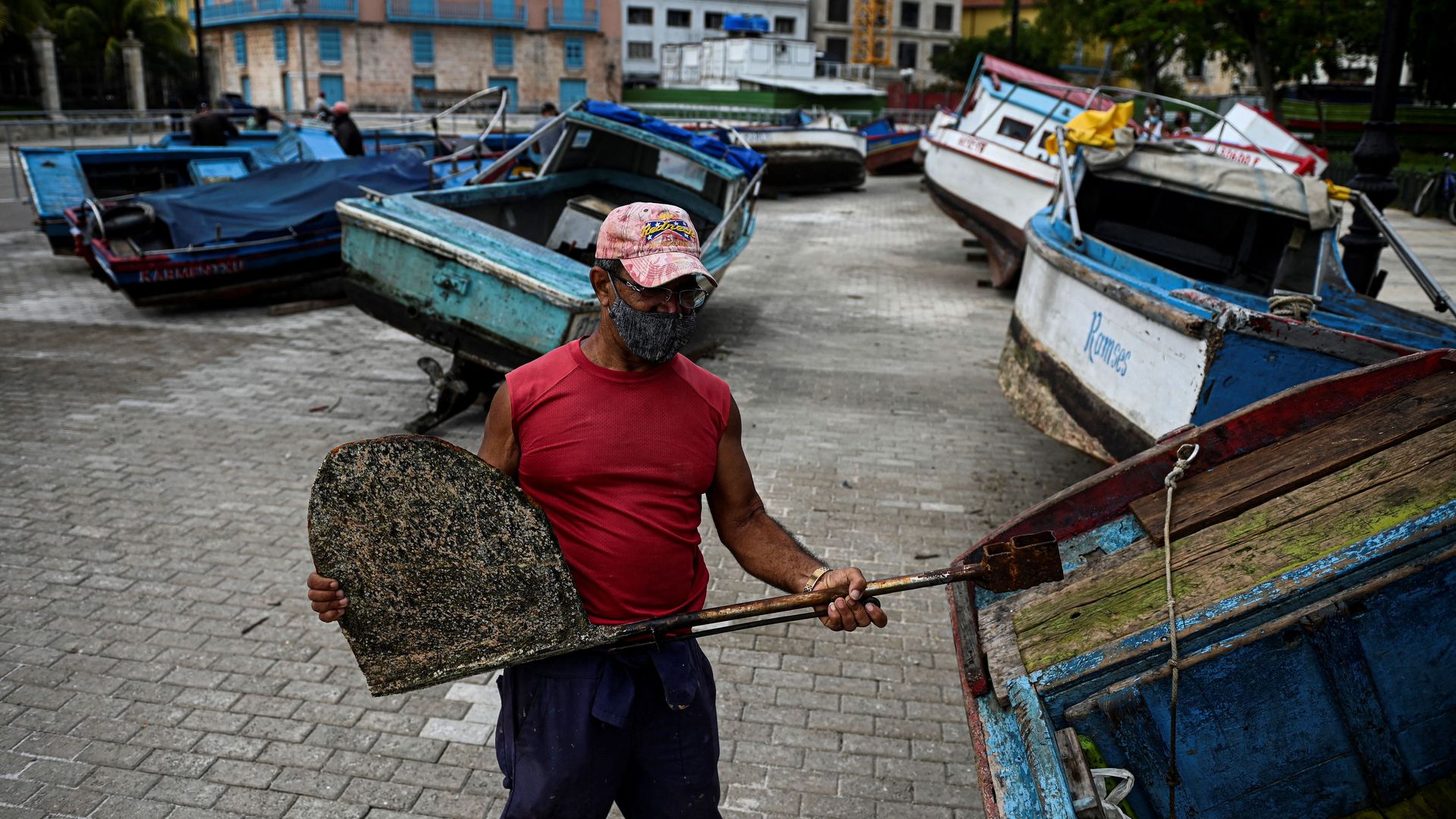 A fisherman secures his boat to land ahead of the passage of Tropical Storm Elsa in Havana, on July 5, 2021. 