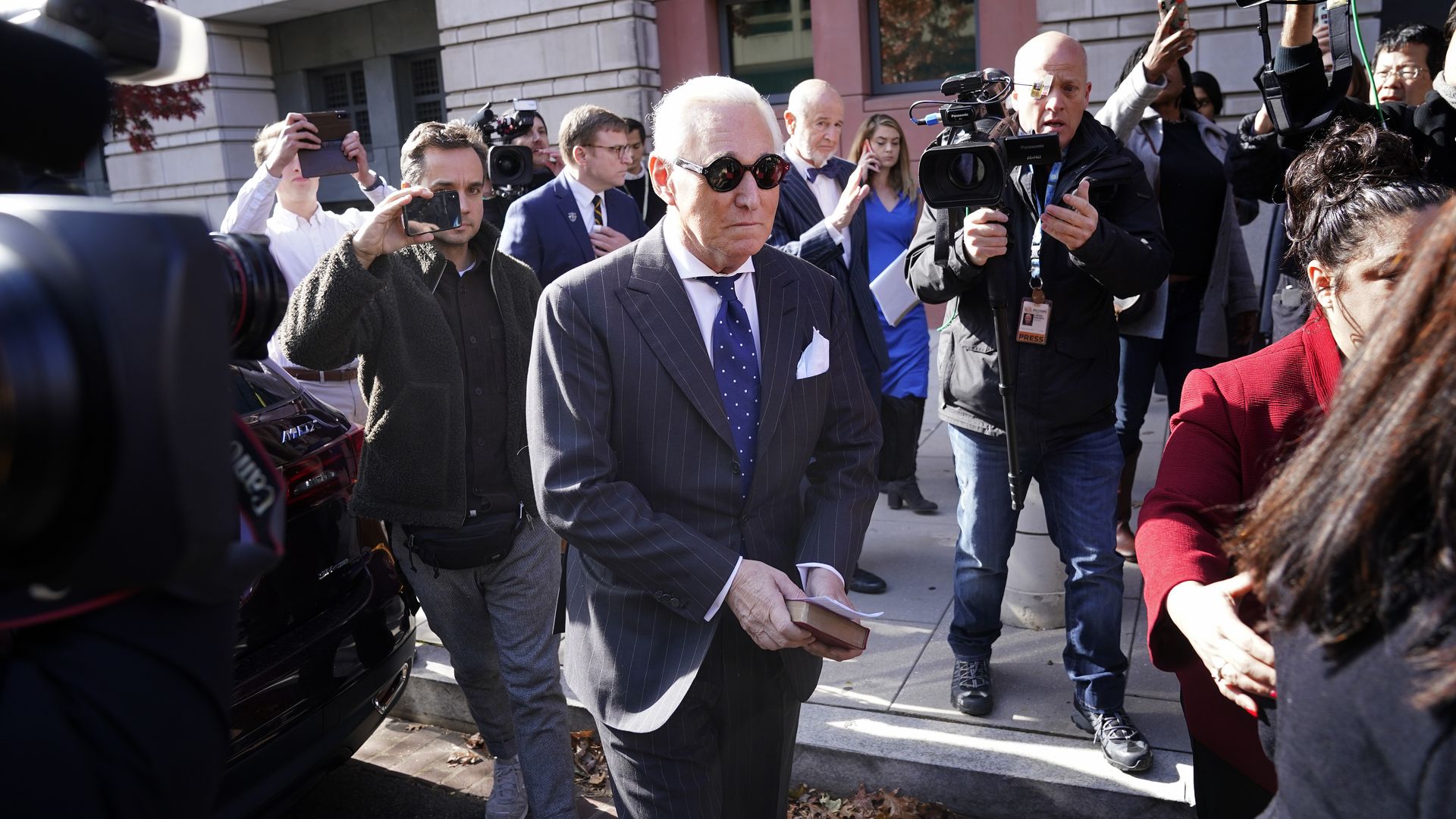 Roger Stone walking out of the courthouse after being found guilty.