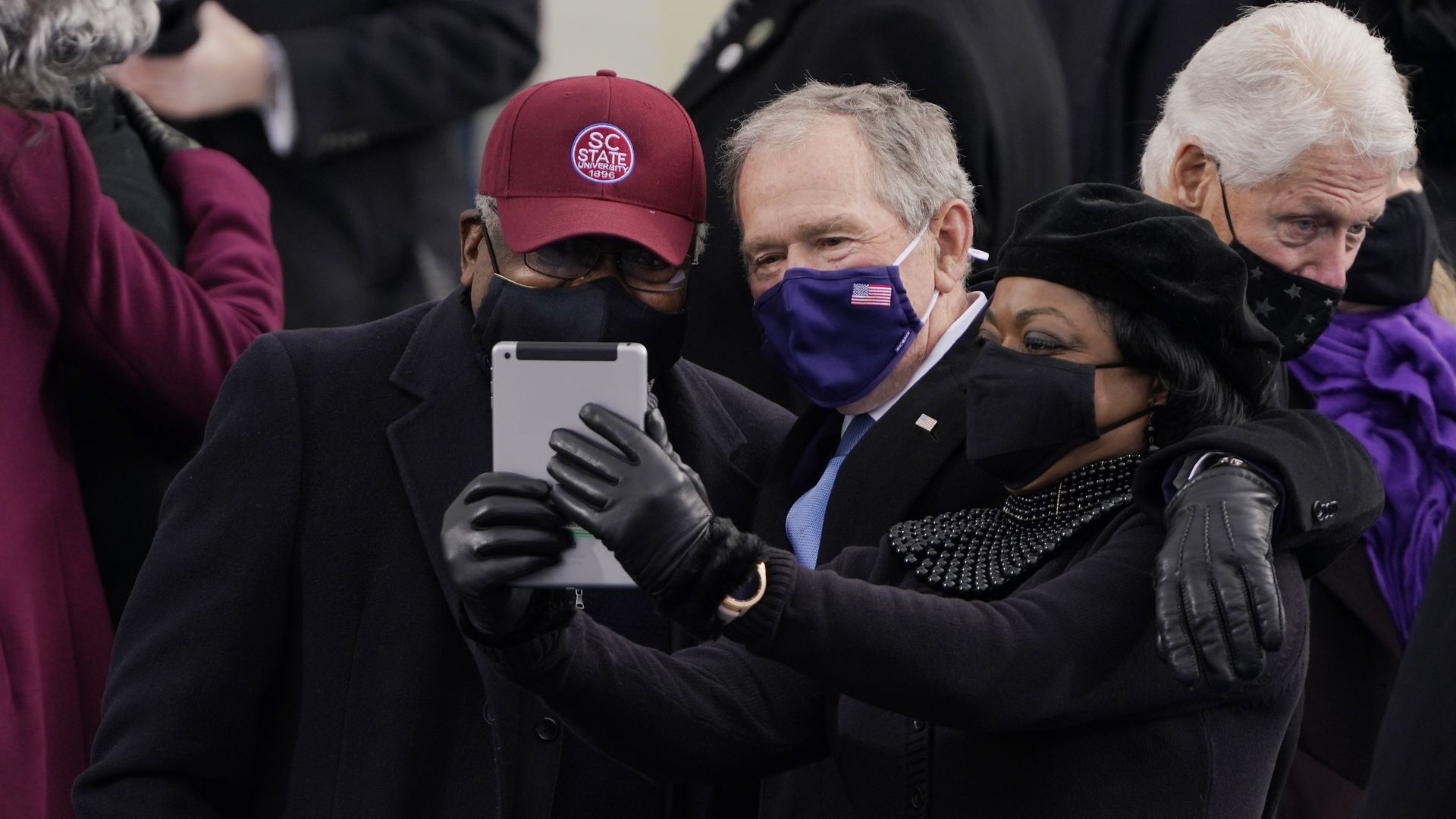 Former President George W. Bush is seen posing for a selfie with Rep. James Clyburn.