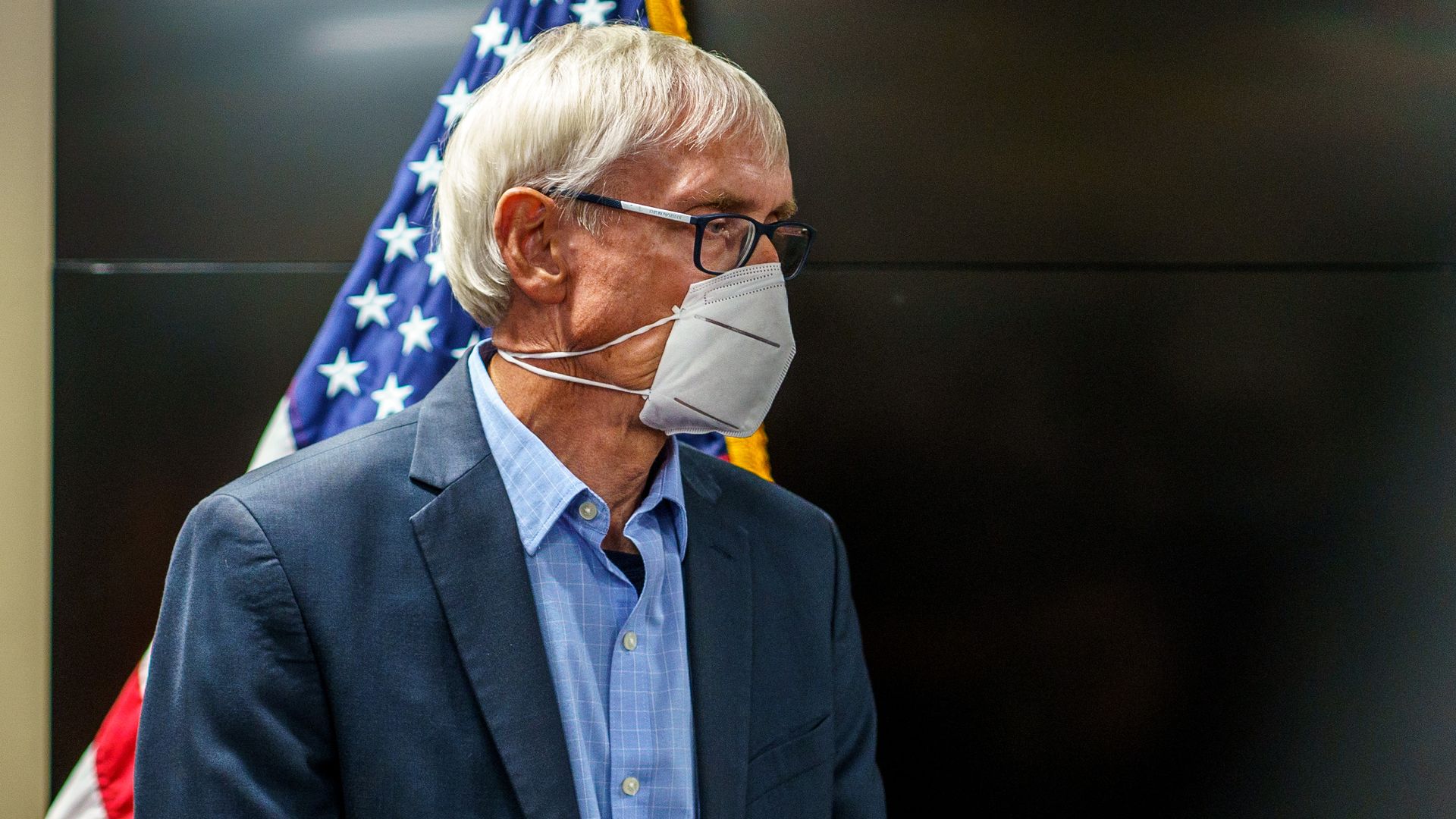 Tony Evers wears a face mask