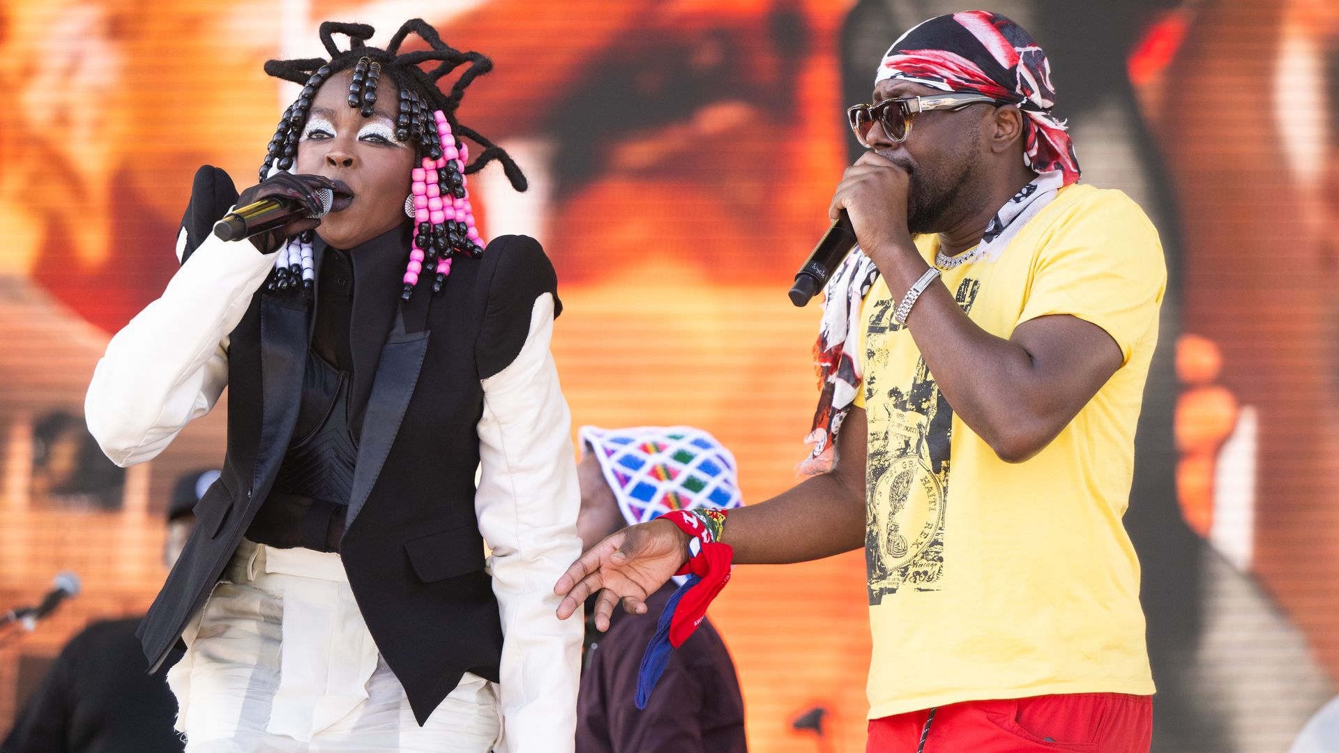 Singers Lauryn Hill and Wyclef Jean of The Fugees performs onstage during Weekend 2 - Day 3 of the Coachella Valley Music & Arts Festival
