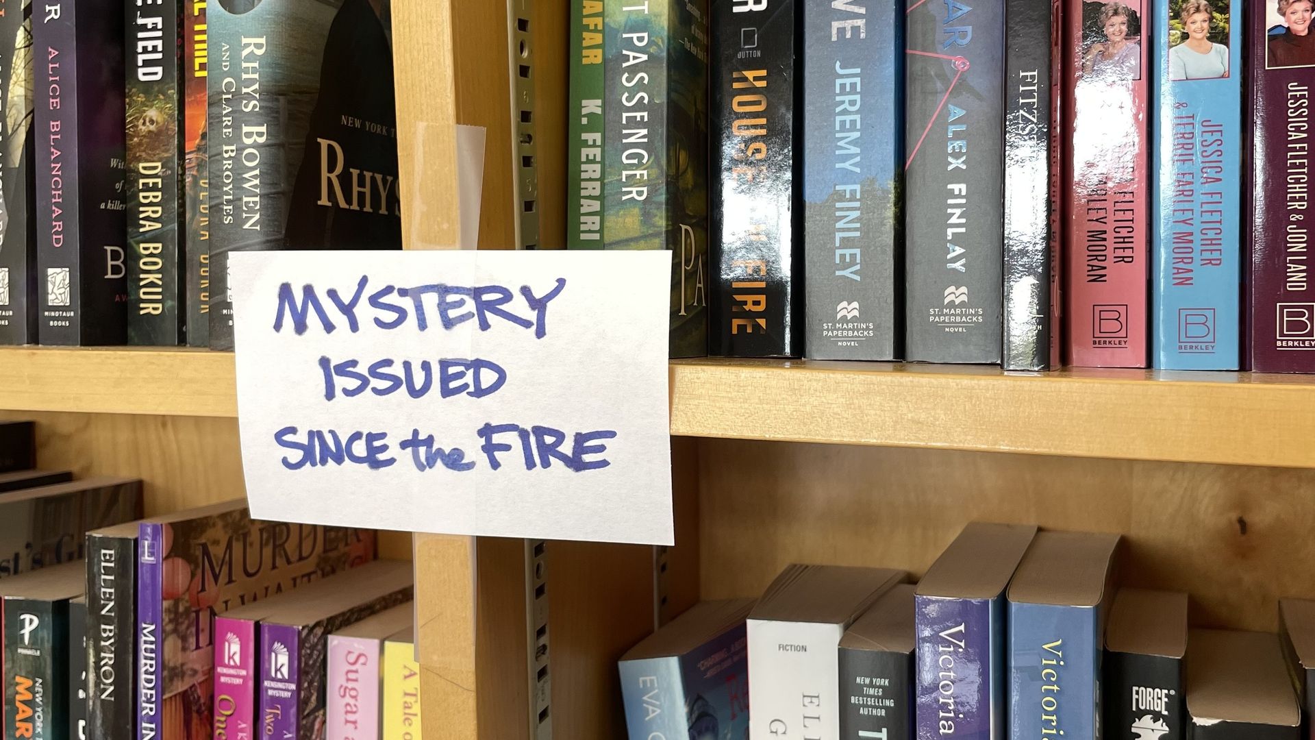 A sign that reads Mystery Issued Since The Fire.