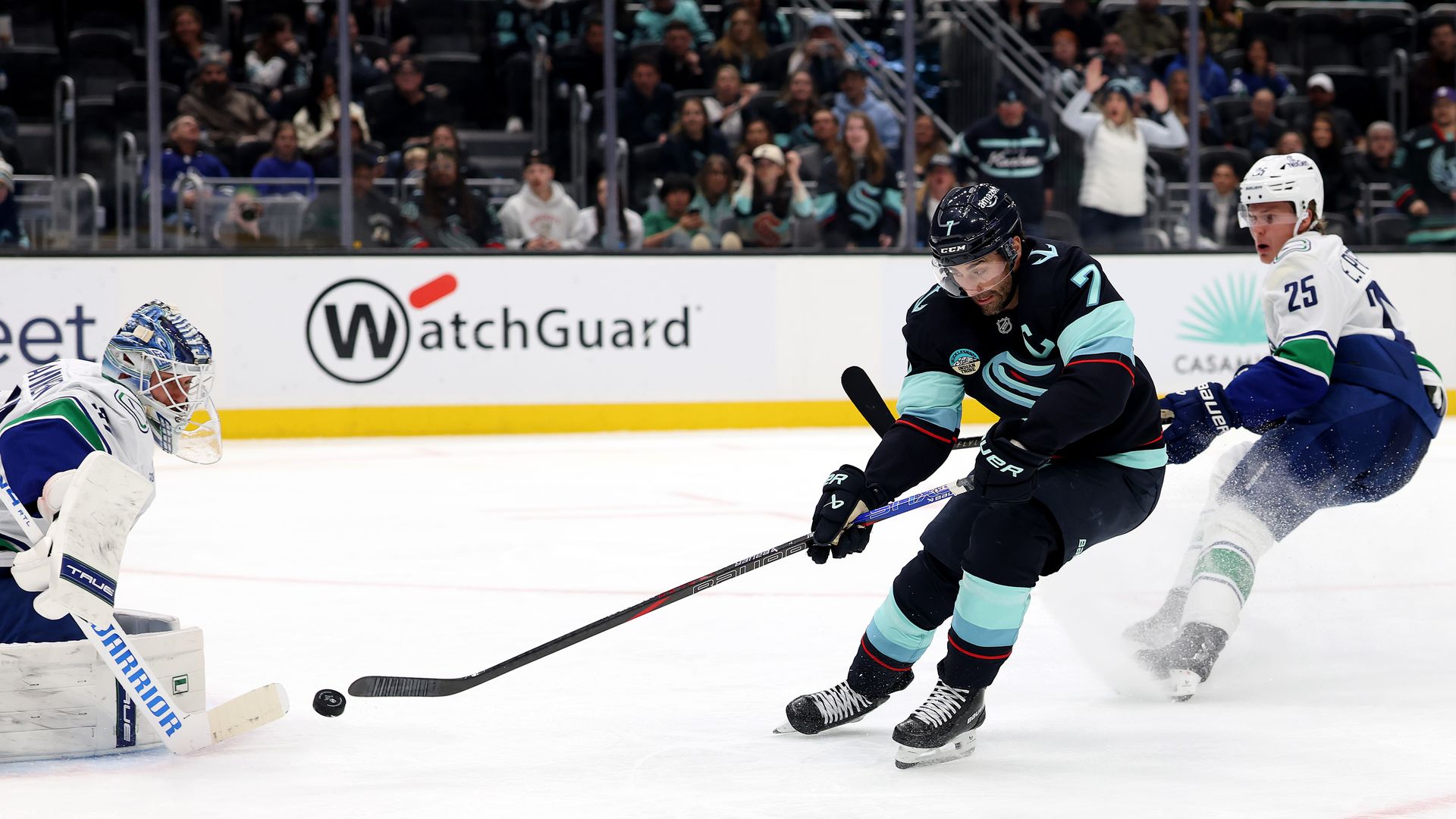 Jordan Eberle of the Seattle Kraken scores past Kevin Lankinen of the Vancouver Canucks.