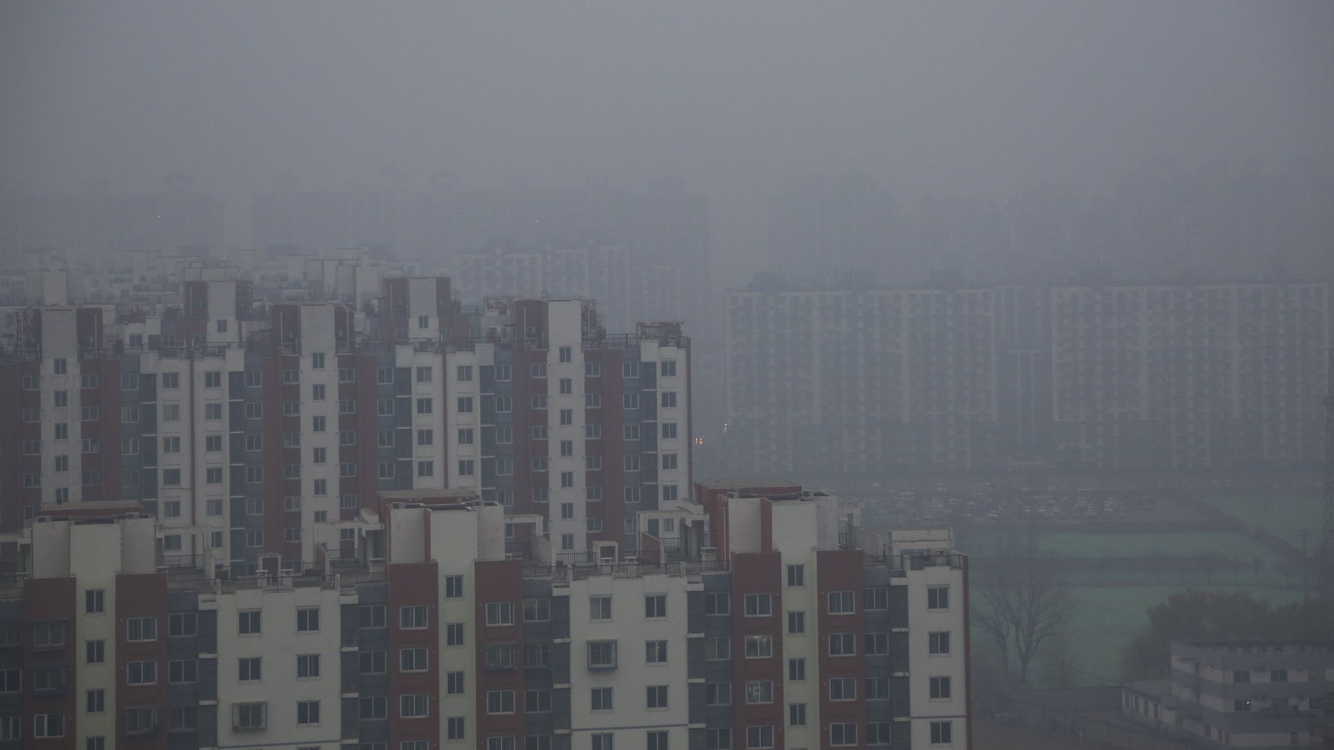 Buildings are seen in smog and fog in December 2018 in Beijing. 