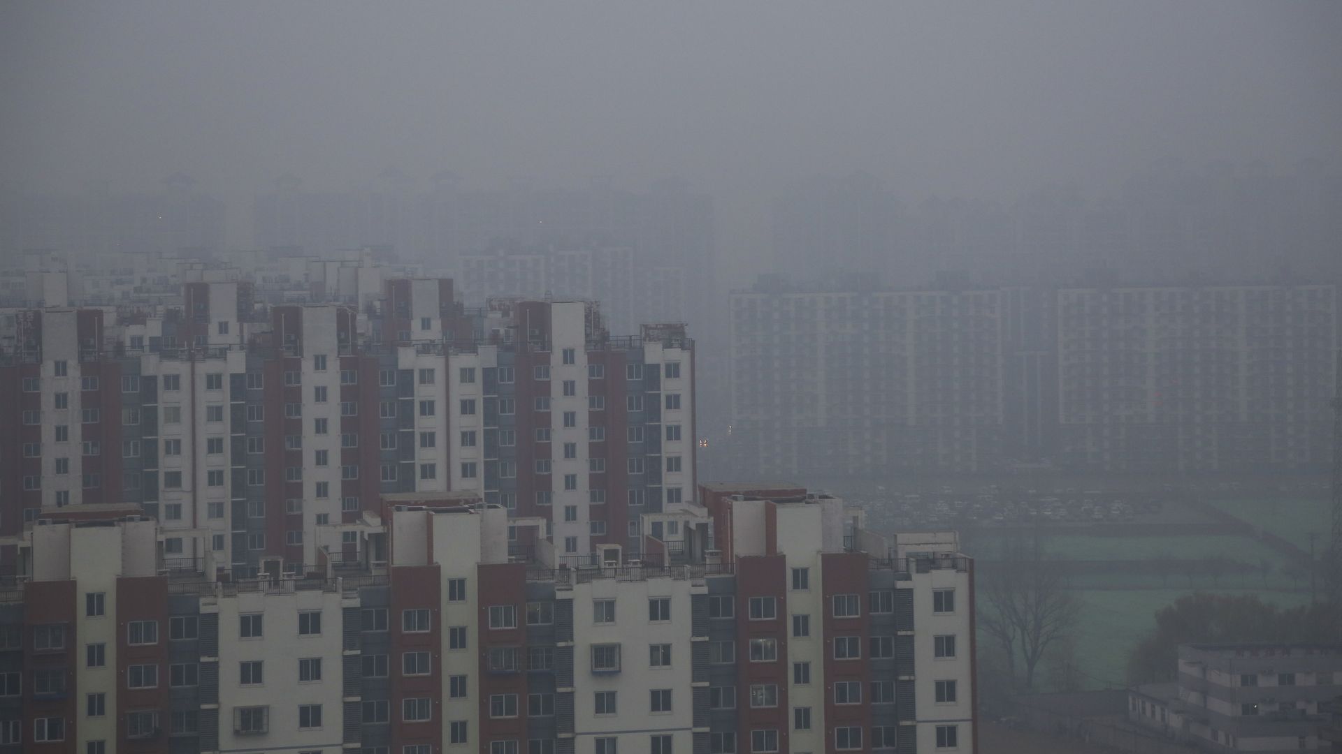 Buildings are seen in smog and fog in December 2018 in Beijing.