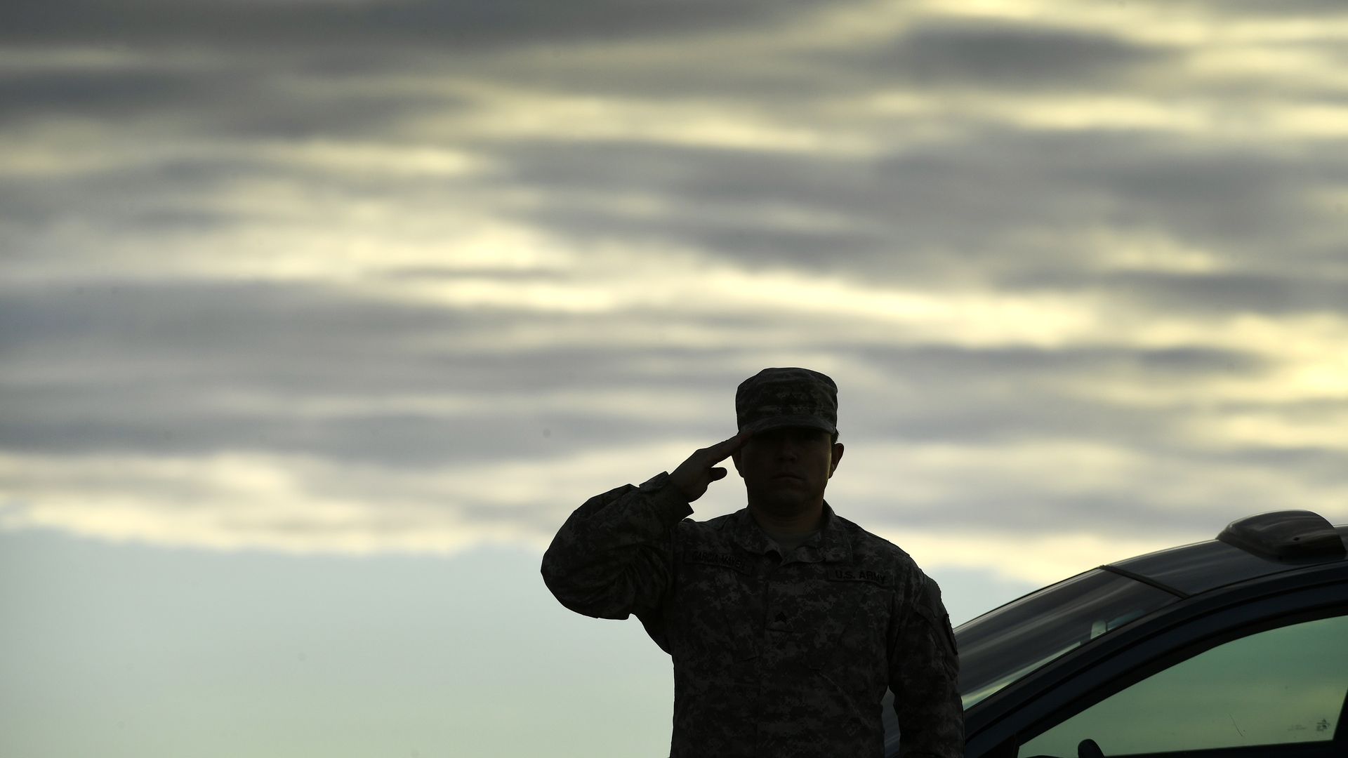 Army Sergeant salutes.