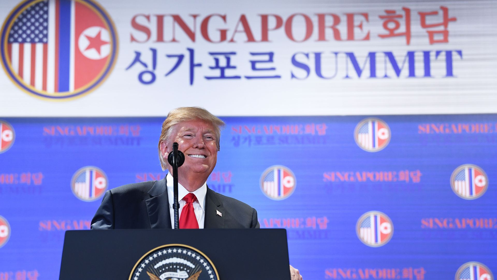 Donald Trump at lectern at Singapore summit