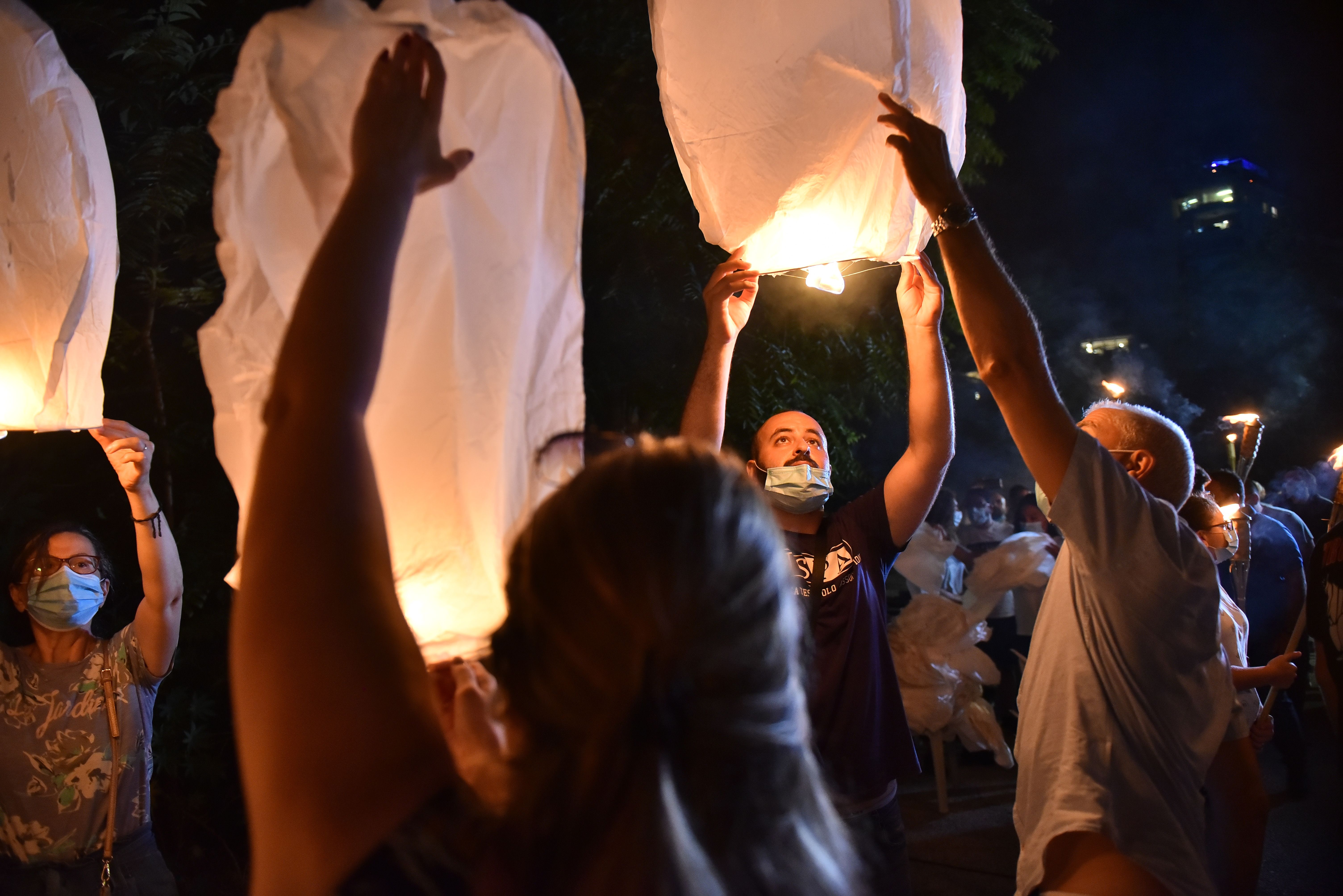Supporters of the Free Patriotic Movement release white balloons to mark one year after the explosion.