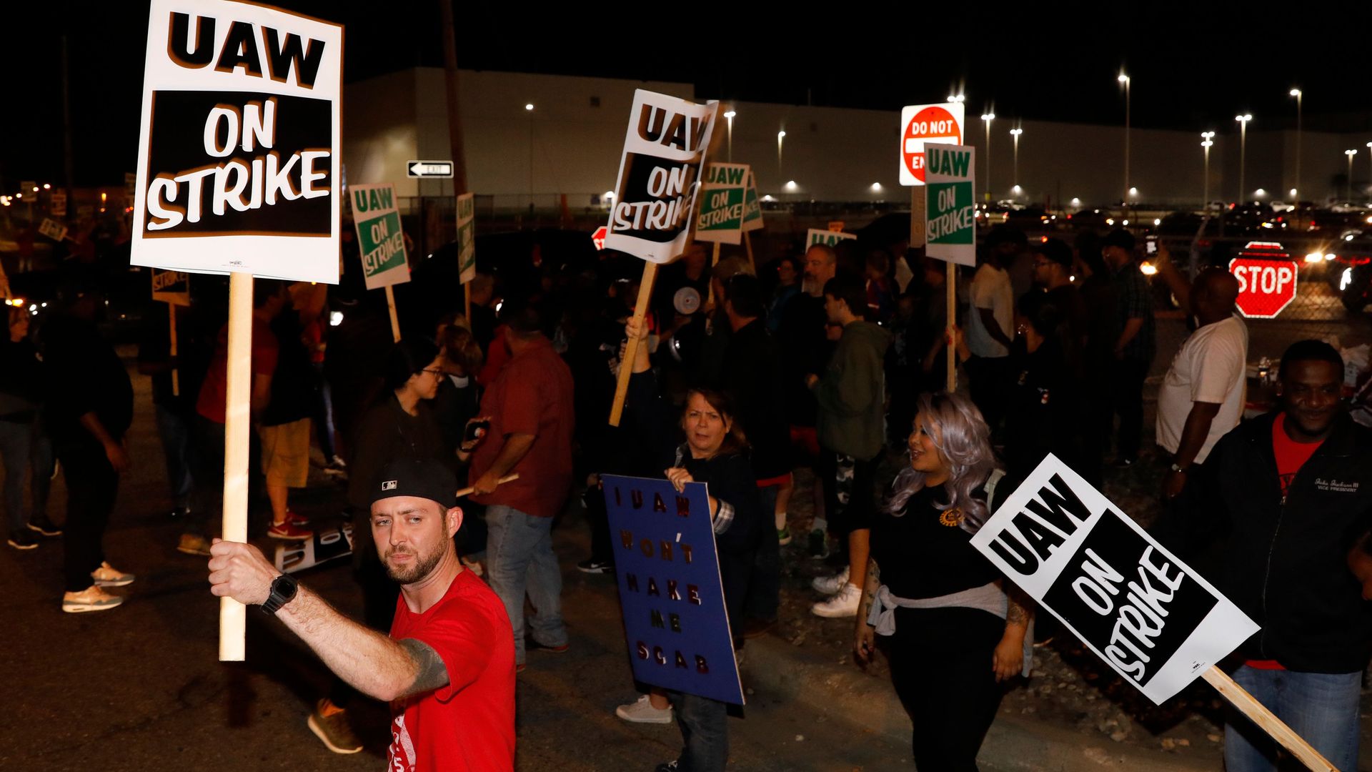 Photo of UAW workers striking outside the GM plant in Flint, Michigan, after midnight on Sept. 16.