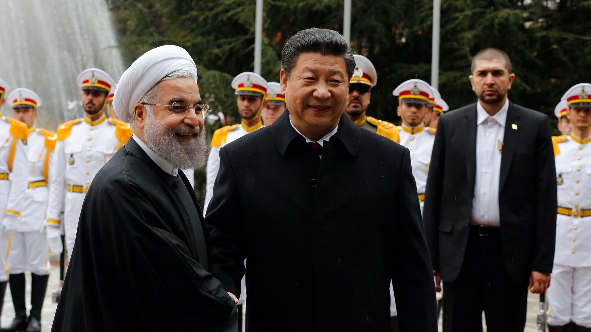 Hassan Rouhani shaking hands with Xi Jinping