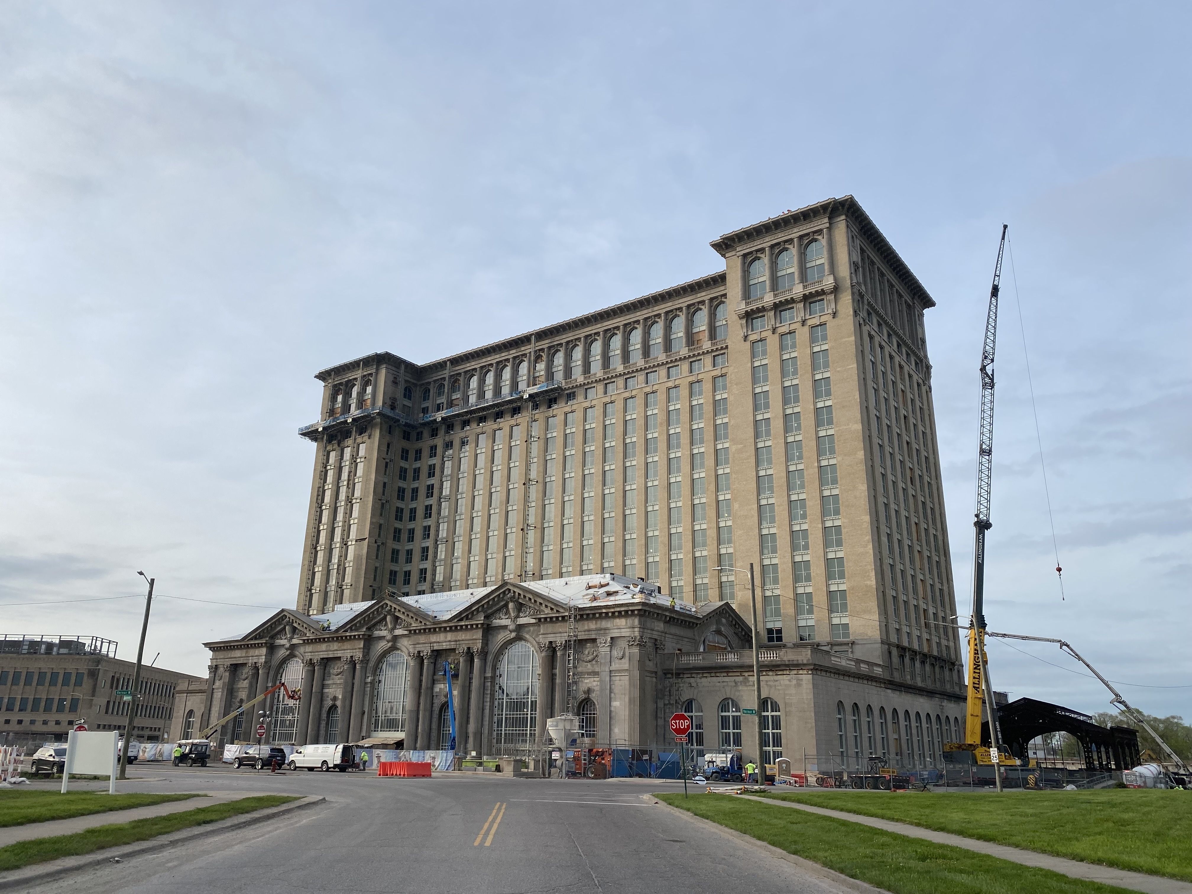 Michigan Central Station building is shown with construction equipment. 
