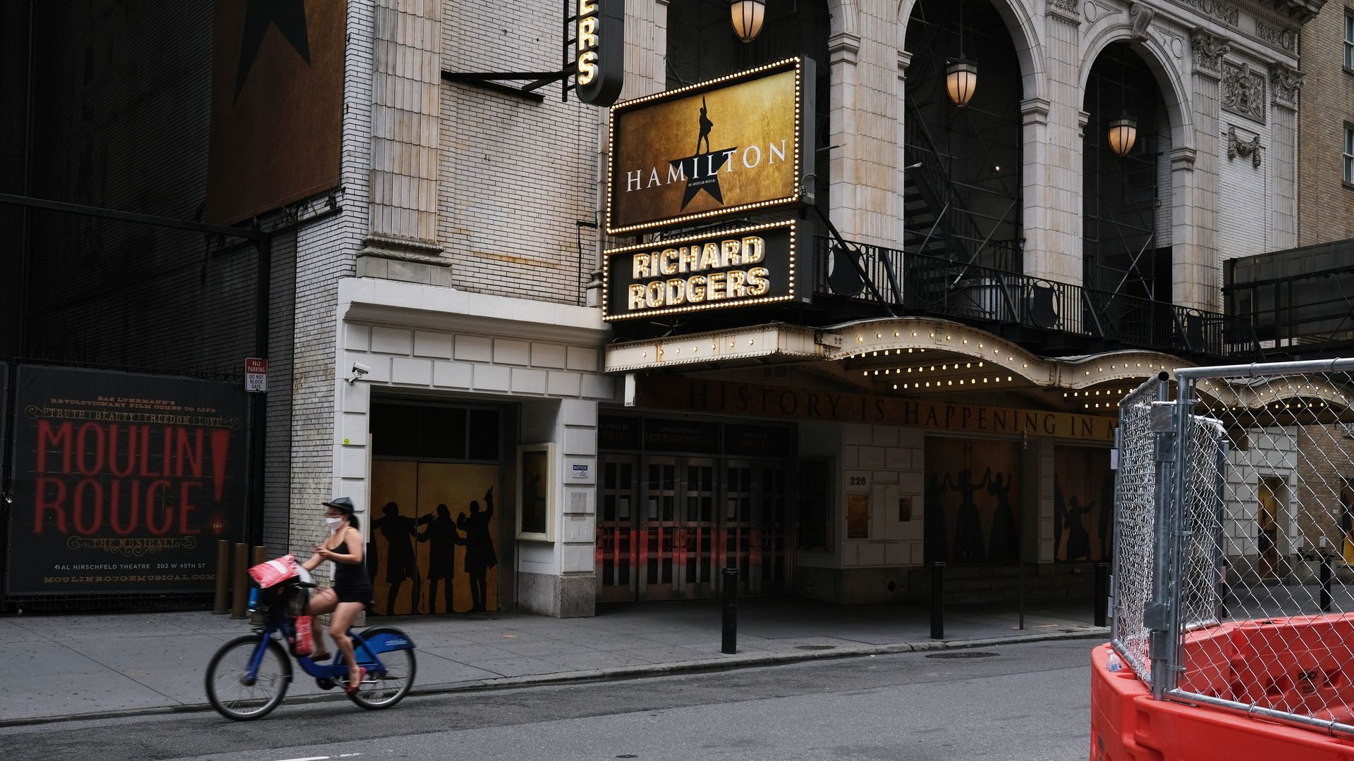 Broadway theaters stand closed along an empty street in the theater district on June 30, 2020 in New York City