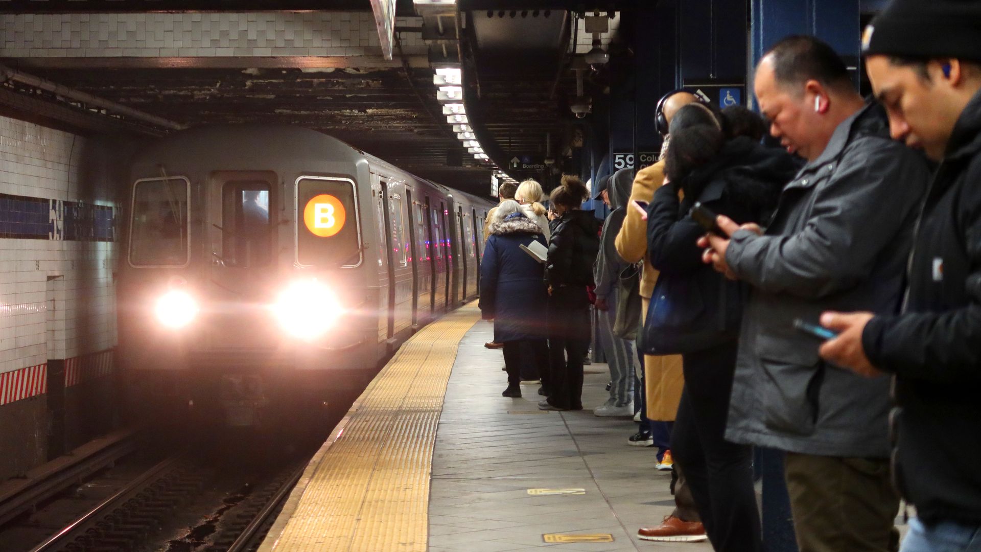  People wait to board a B line subway train at the Columbus Circle - 59th Street station on February 26, 2024, in New York City. (Photo by Gary Hershorn/Getty Images)