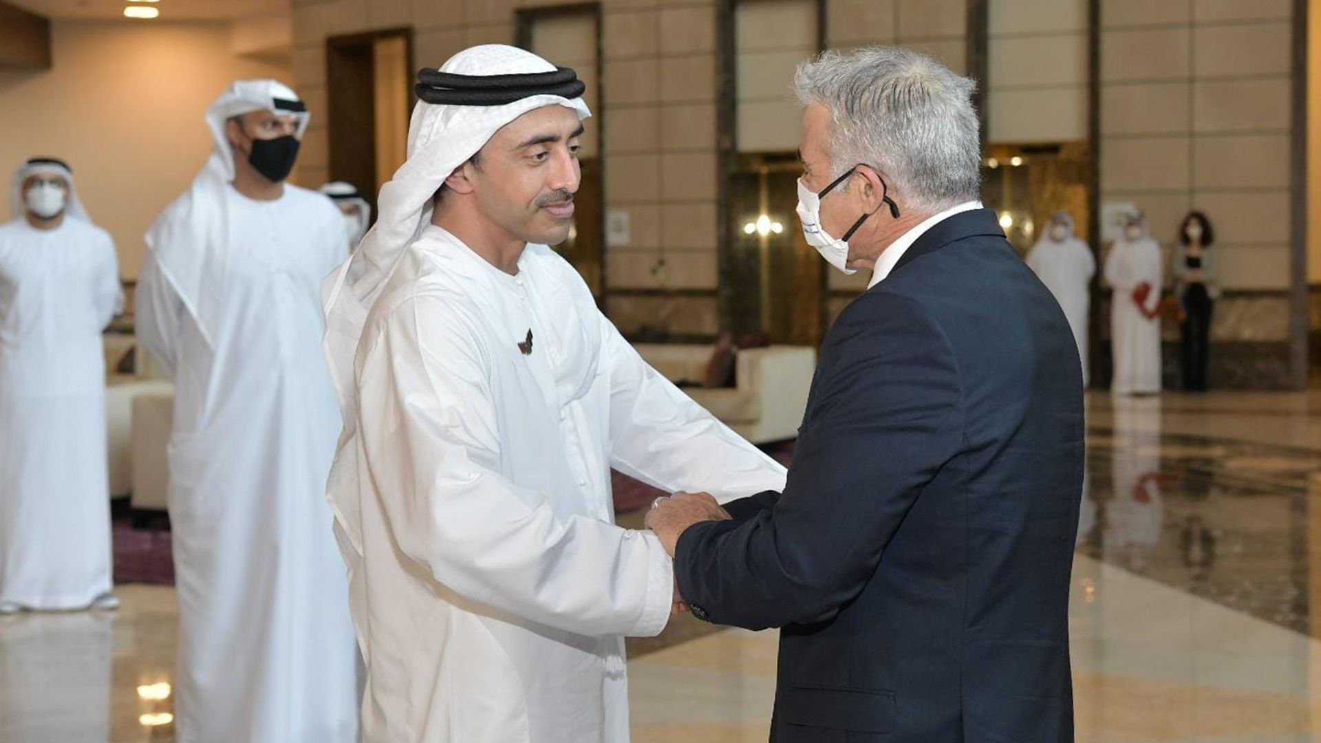 United Arab Emirates foreign minister Sheikh Abdullah bin Zayed shakes hands with Israeli foreign minister Yair Lapid
