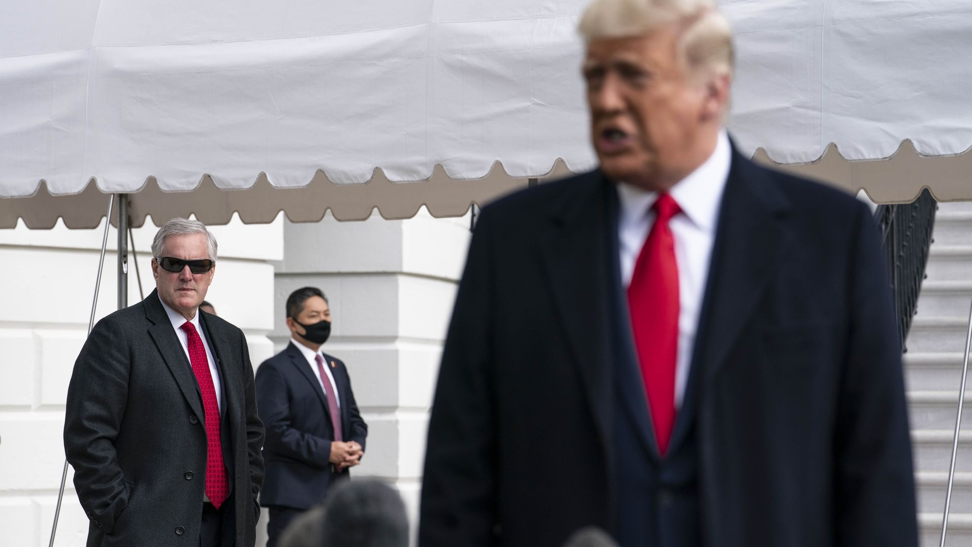 Photo of Mark Meadows looking at Donald Trump