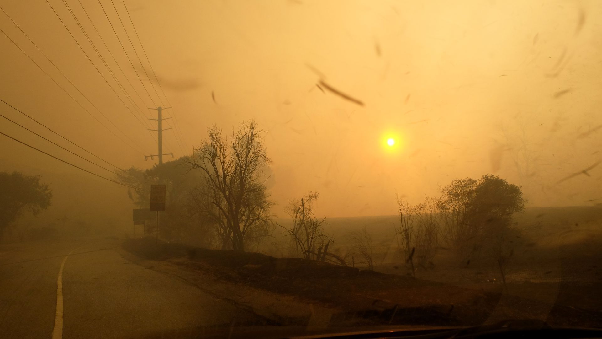 Smoke and ash partially block out the sun from the Woolsey fire on Nov. 9.