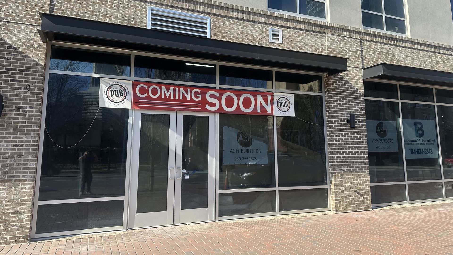 outside of building with a sign that reads coming soon