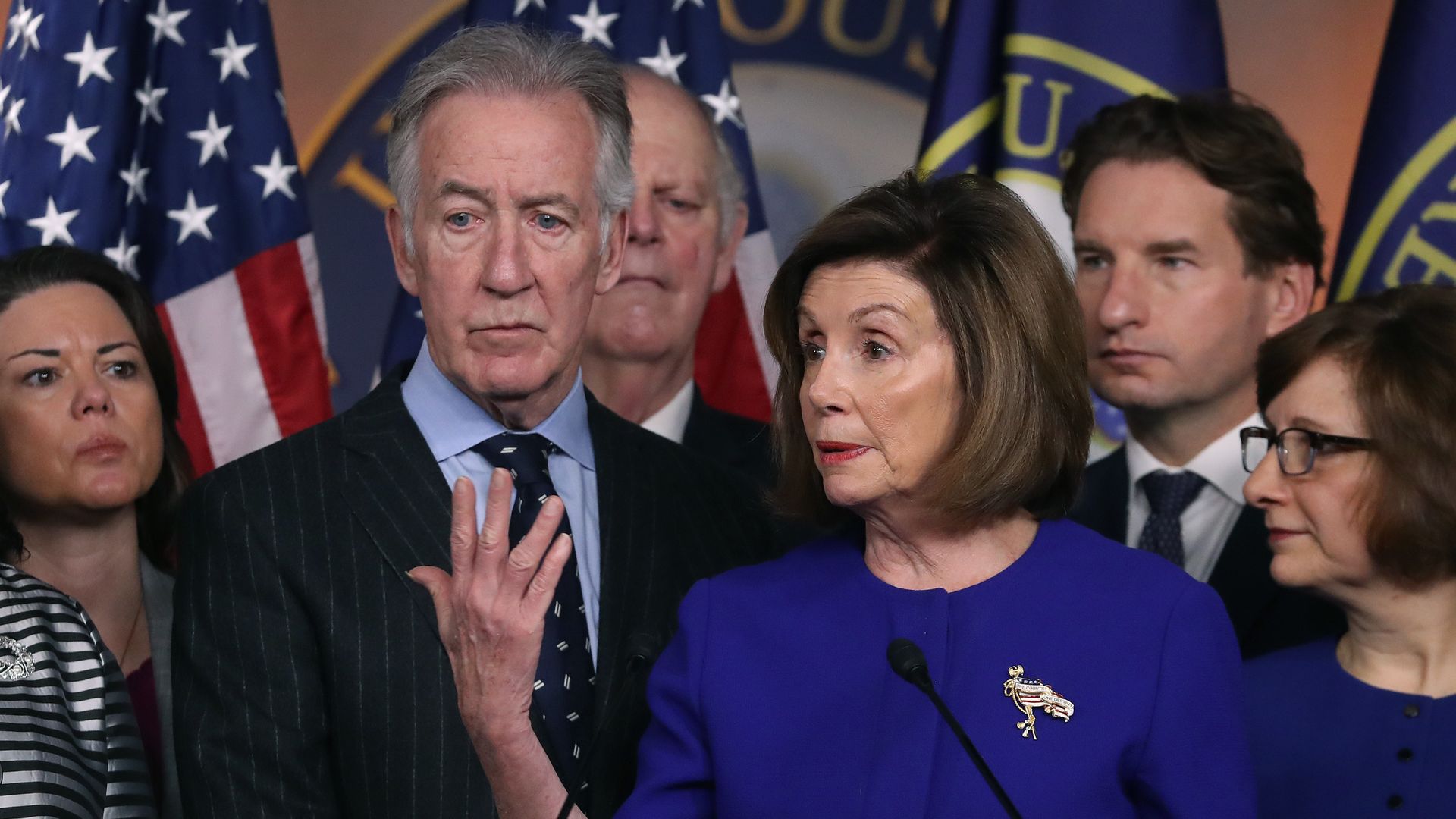 Nancy Pelosi and a group of Democrats at a press conference