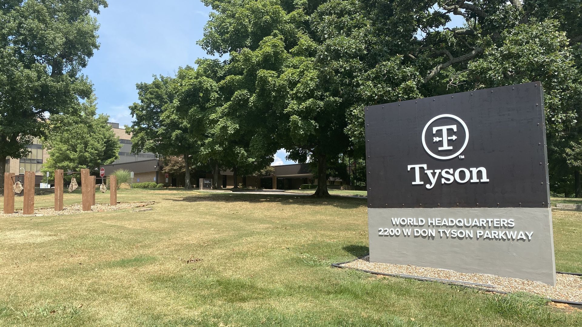Picture of the Tysons Food headquarters, with a black sign that says "Tysons"