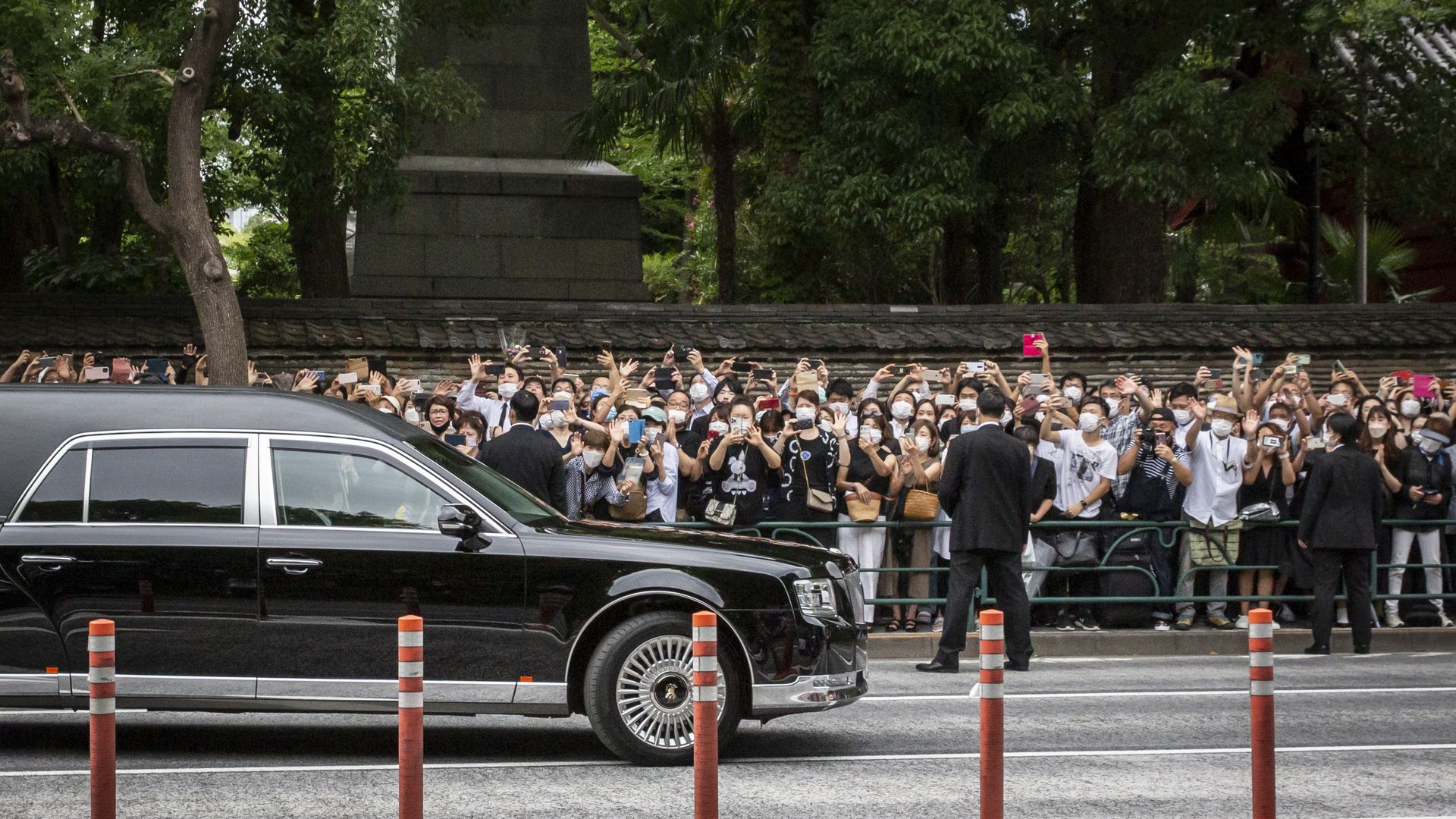 A car carrying the body of Japan's former prime minister Shinzo Abe leaves Zojoji temple where his funeral was held on July 12, 2022 in Tokyo, Japan.