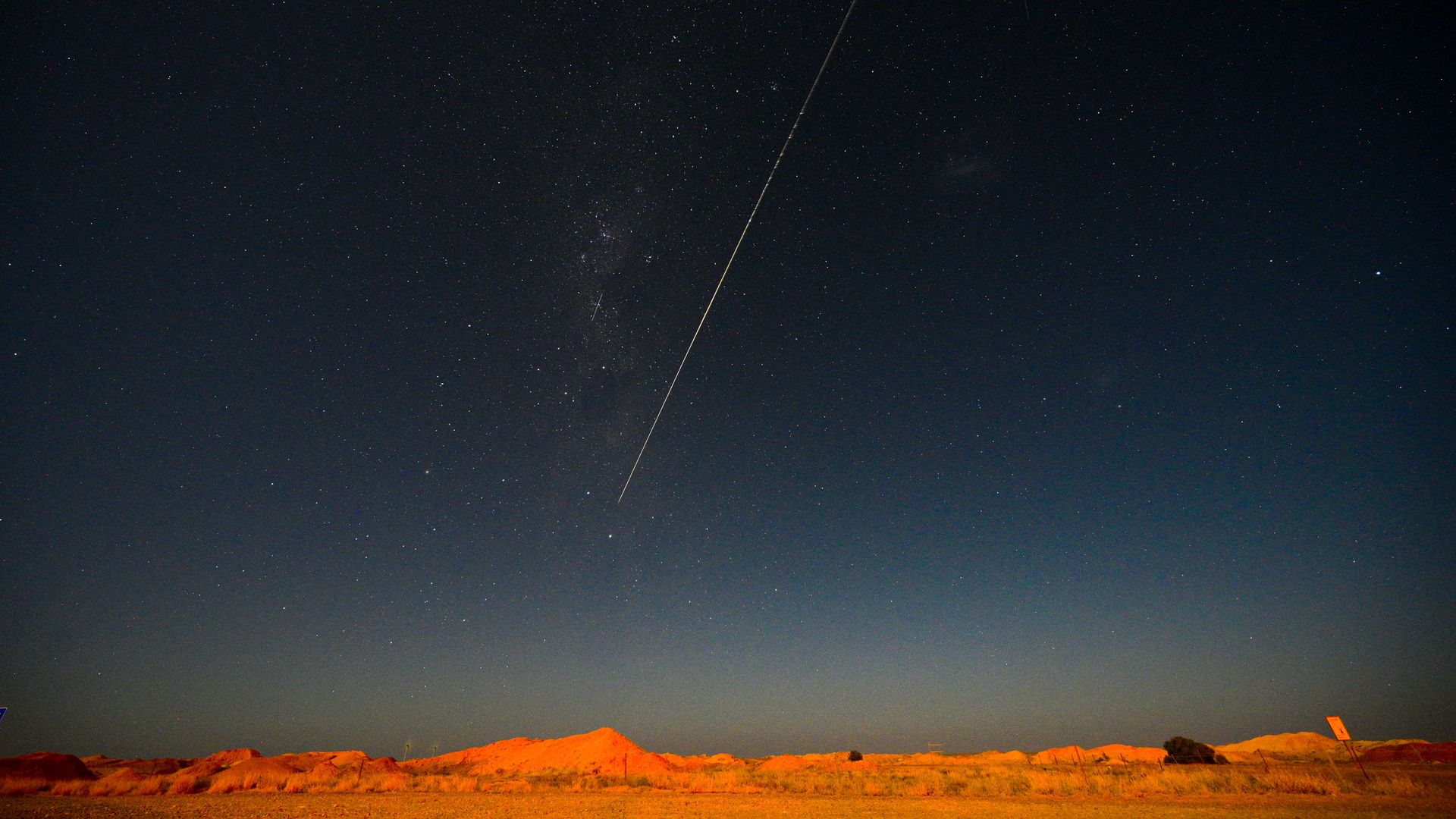 JAXA's Hayabusa-2 probe's sample drop to earth after landing on and gathering material from an asteroid some 300 million kilometres from Earth is seen from Coober Pedy in South Australia on