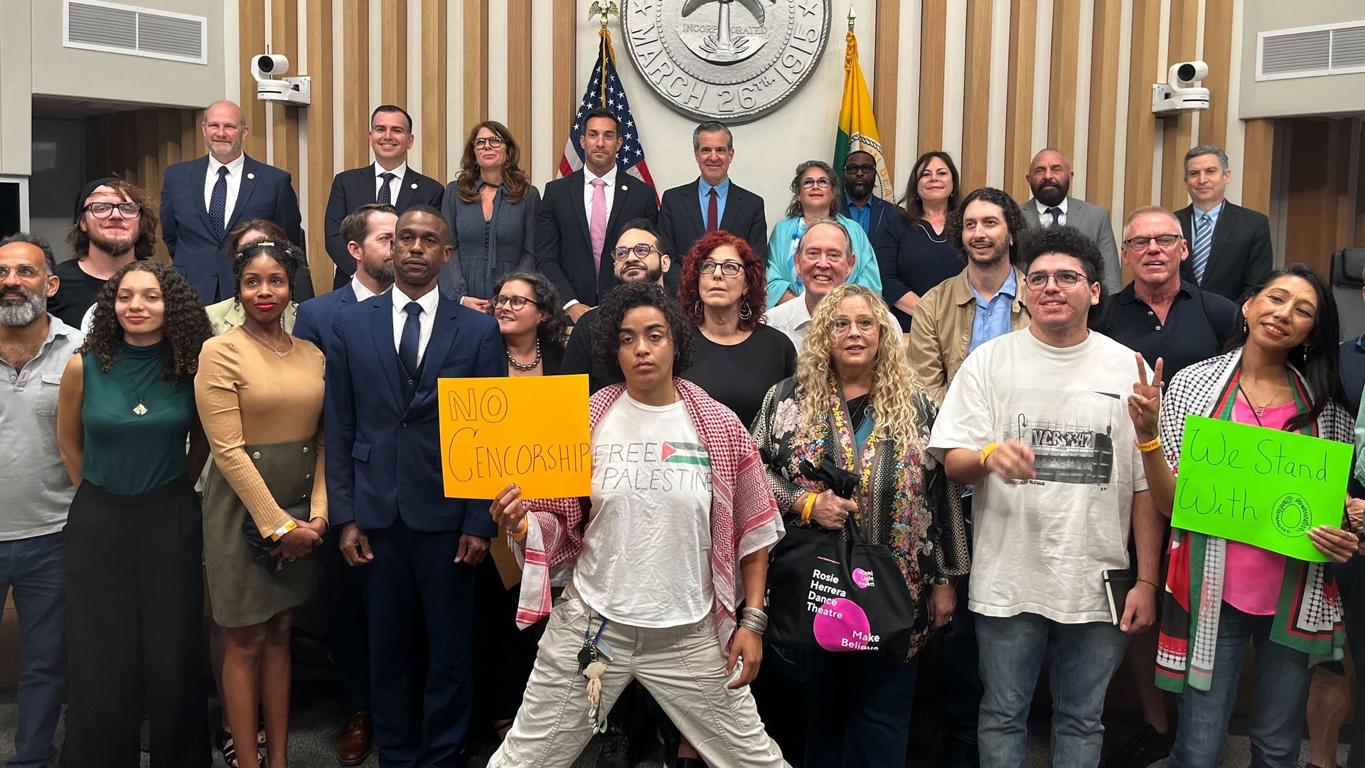 The Miami Beach City Commissions and supporters of O Cinema pose for a group photo after a resolution evicting the theater was withdrawn.