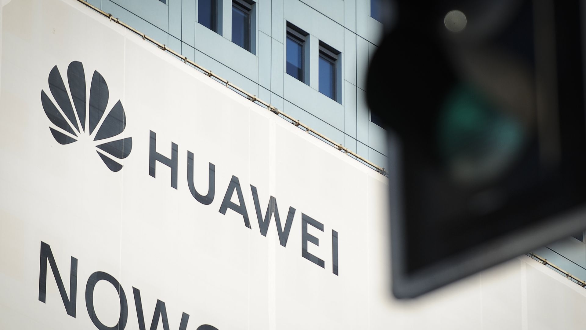 A sign with the Huawei logo