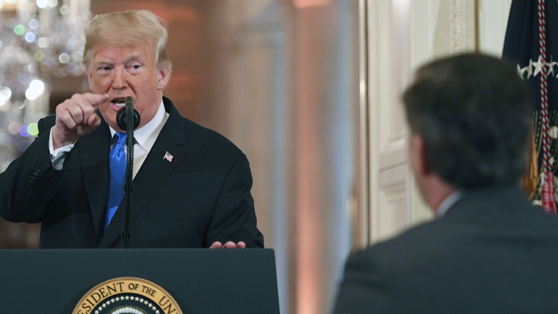 President Donald Trump points to journalist Jim Acosta from CNN during a post-election press conference