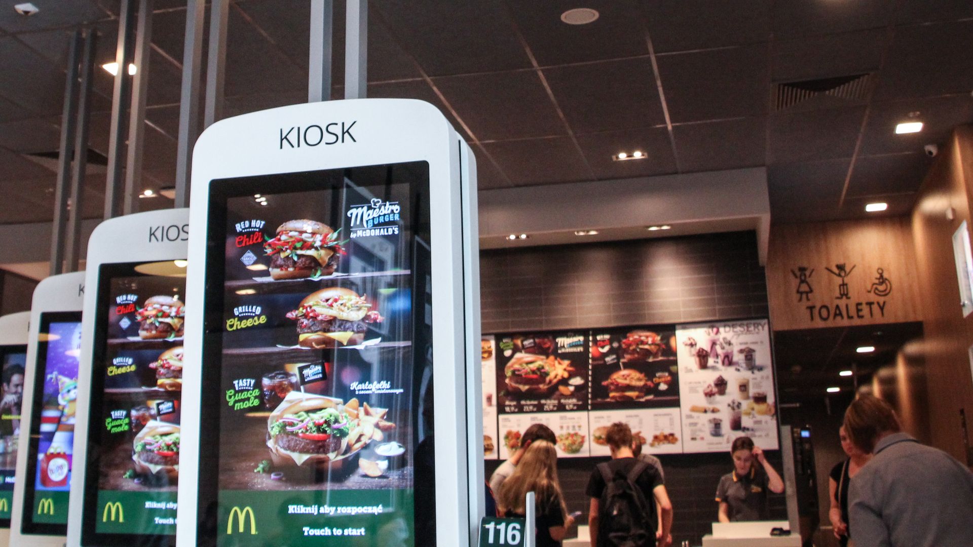 McDonald's store with self-ordering kiosks inside of it