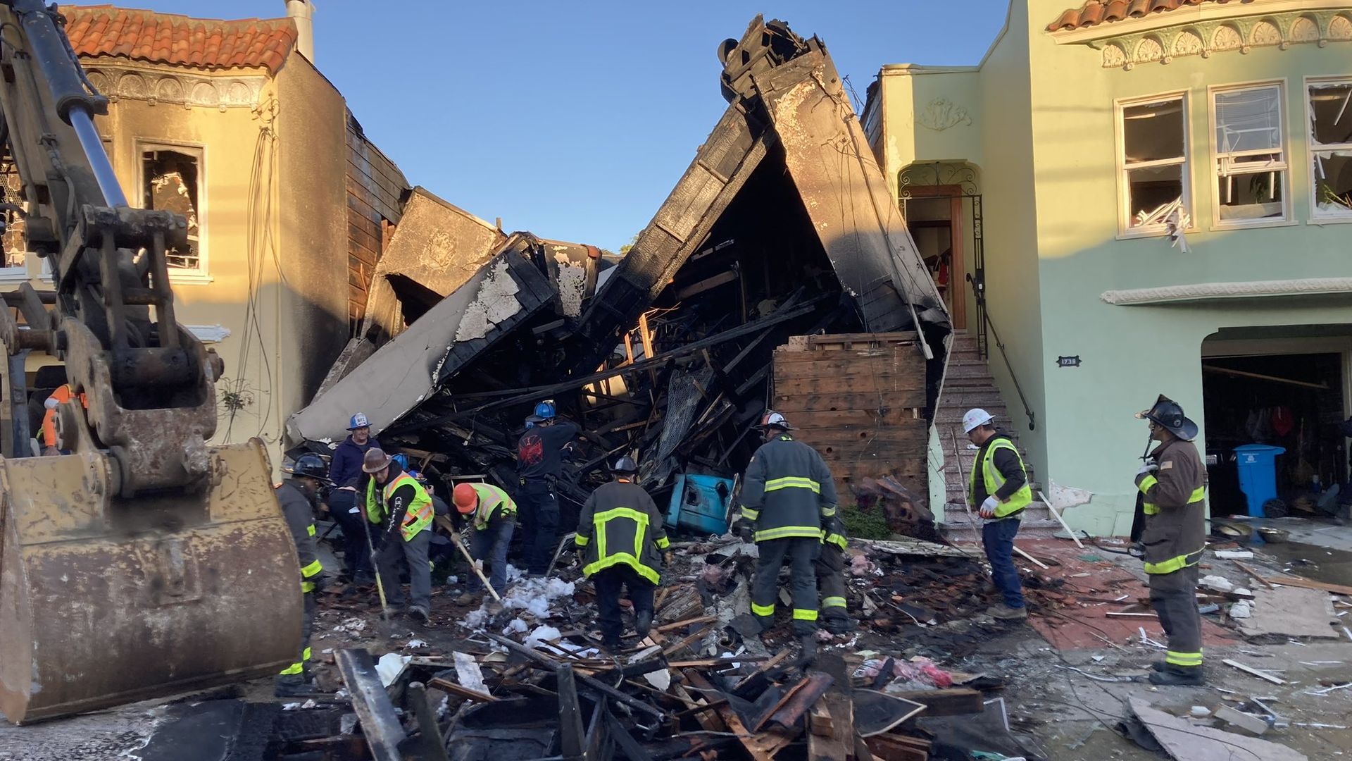 Fire crew dig through burned down house