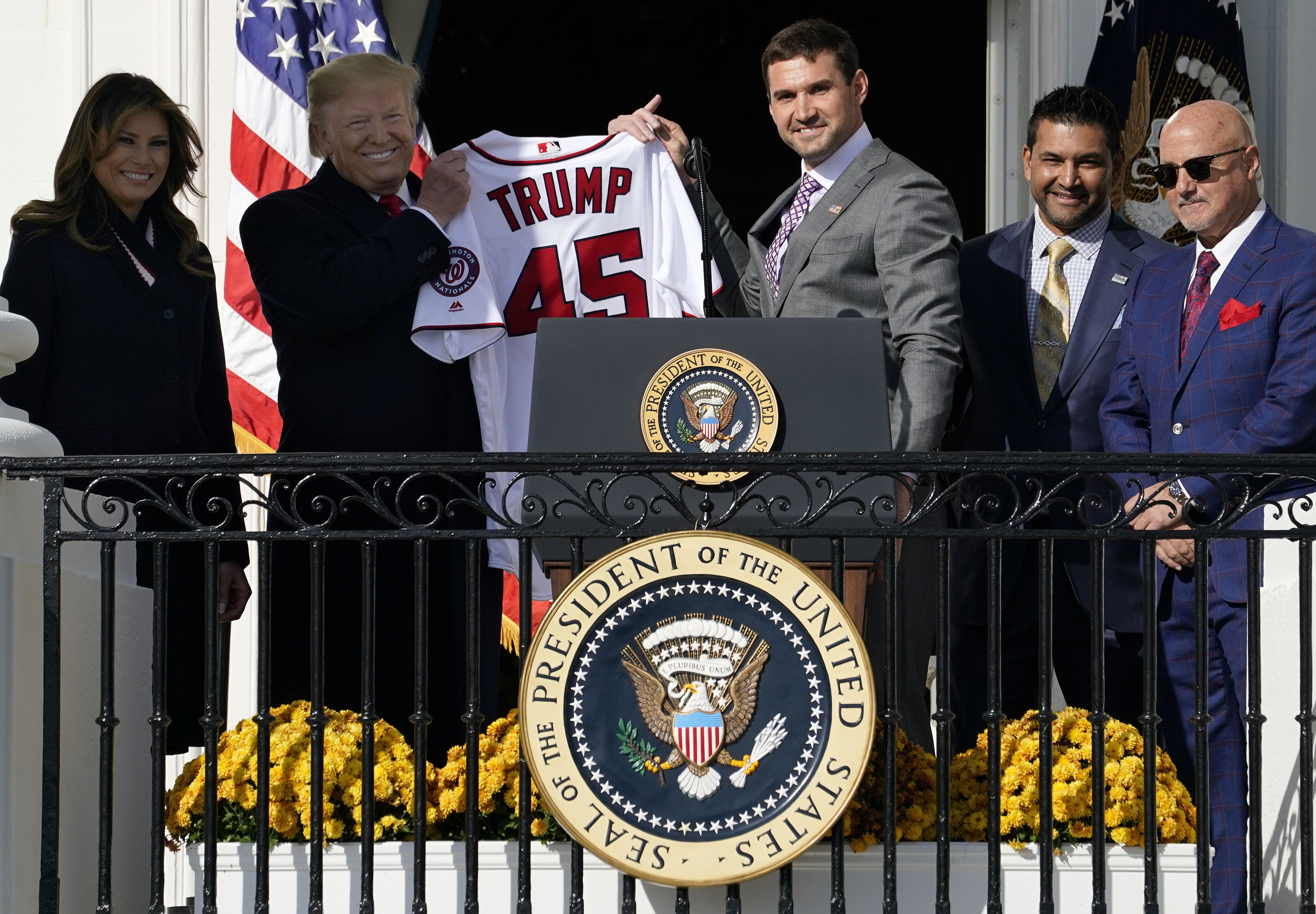 First baseman Ryan Zimmerman presents a Nationals jersey to U.S. President Donald Trump