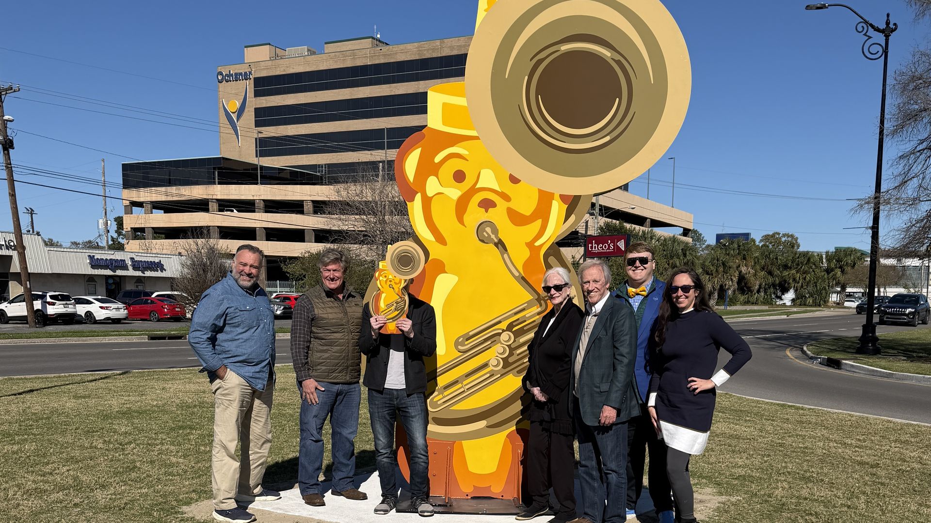 Image shows a honey bear sculpture playing a tuba.